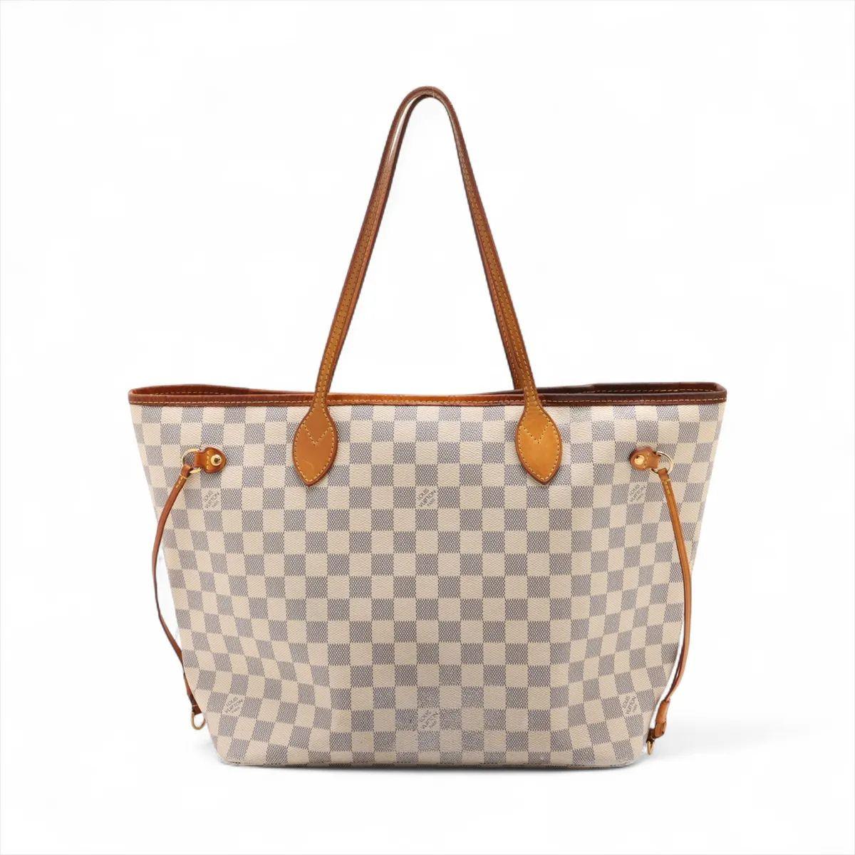 The Louis Vuitton Damier Azur Neverfull MM is a chic and versatile tote bag that combines style with practicality. Crafted from the iconic Damier Azur canvas, the bag features a fresh, light checkered pattern perfect for warmer seasons. The MM size