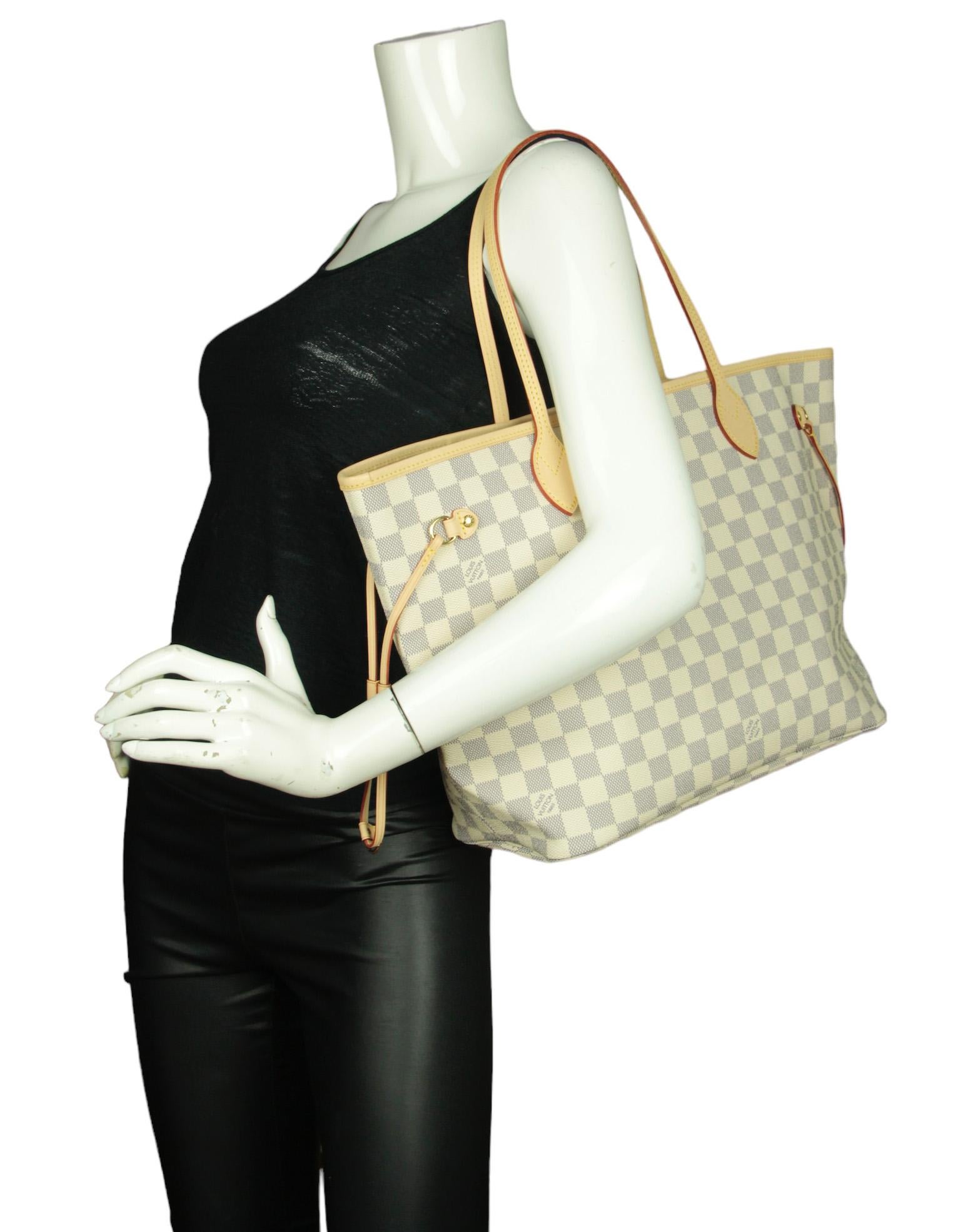 Louis Vuitton Damier Azur Neverfull MM Tote Bag w/ Insert

Color: White, grey
Hardware: Goldtone
Materials: Coated canvas, vachetta leather trim
Lining: Printed canvas
Closure/Opening: Open top with center hook
Exterior Pockets: None
Interior