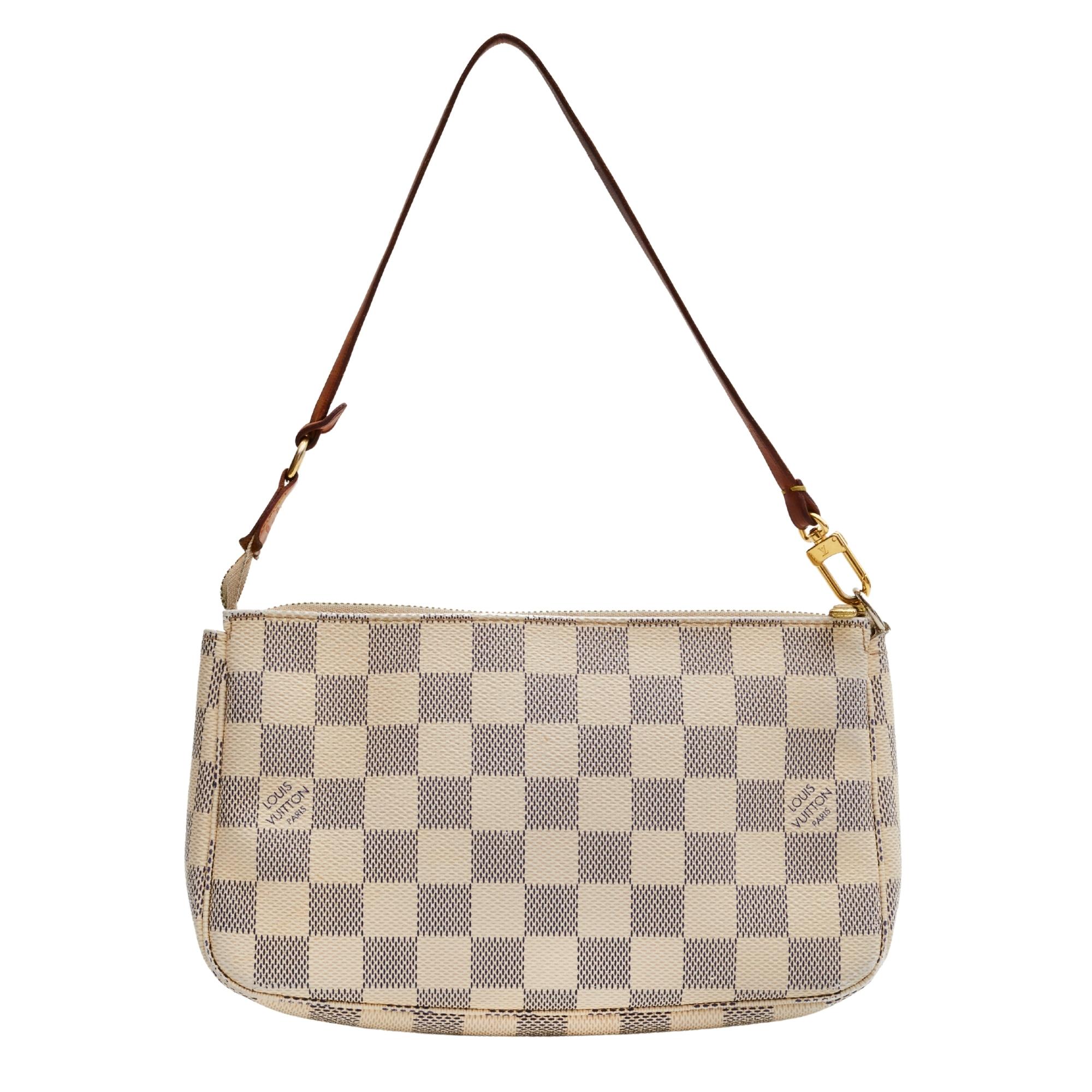 This pochette is crafted with of Louis Vuitton's signature Damier canvas in blue and white. The bag features a vachetta strap and a brass top zipper that opens to a beige fabric interior with a patch pocket.

COLOR: Damier Azur
MATERIAL: Coated