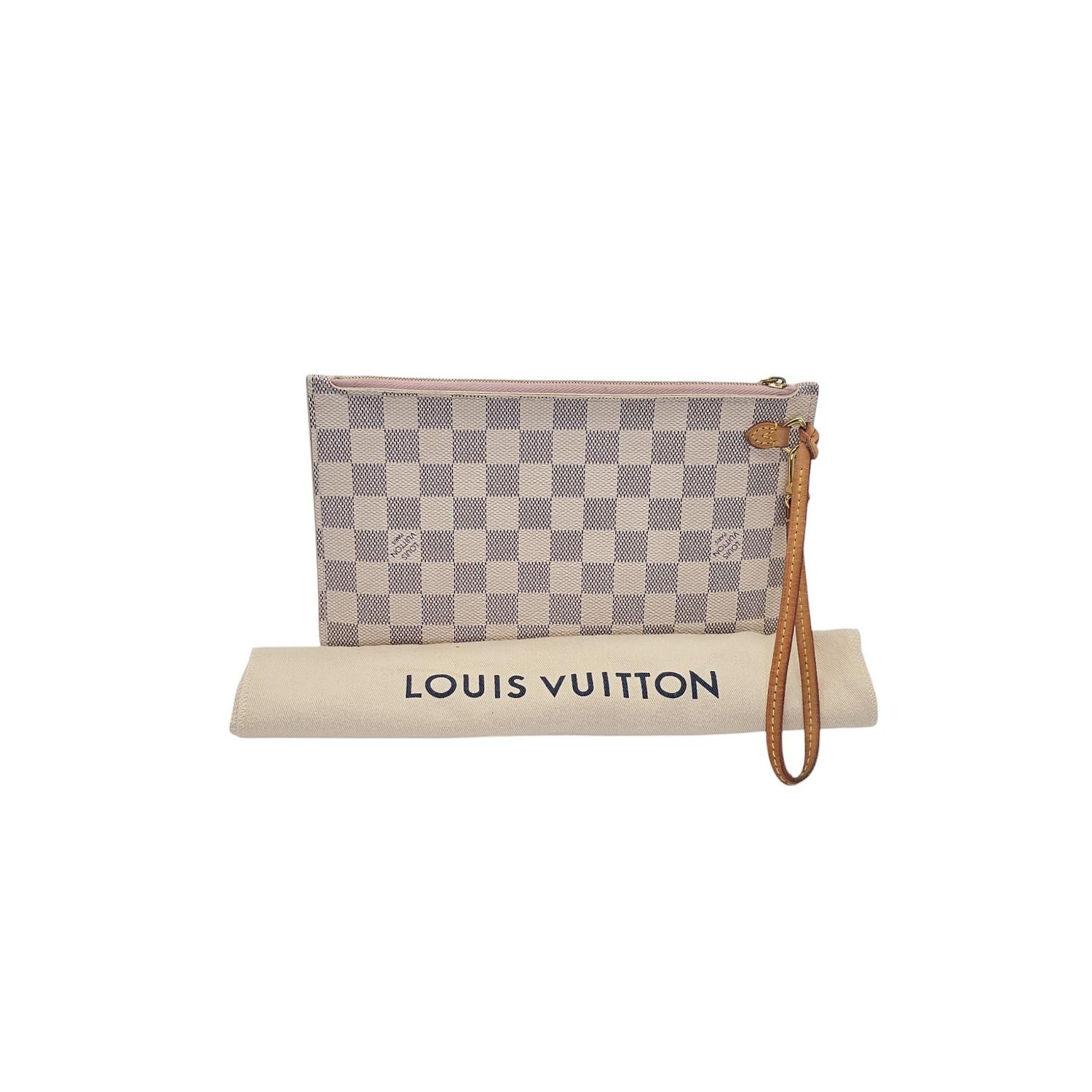 This Louis Vuitton Damier Azur Pochette was made in the USA in 2017 and it is crafted of the classic Louis Vuitton Monogram coated canvas exterior with leather trimming and gold-tone hardware features. It features a zipper closure that opens up to a