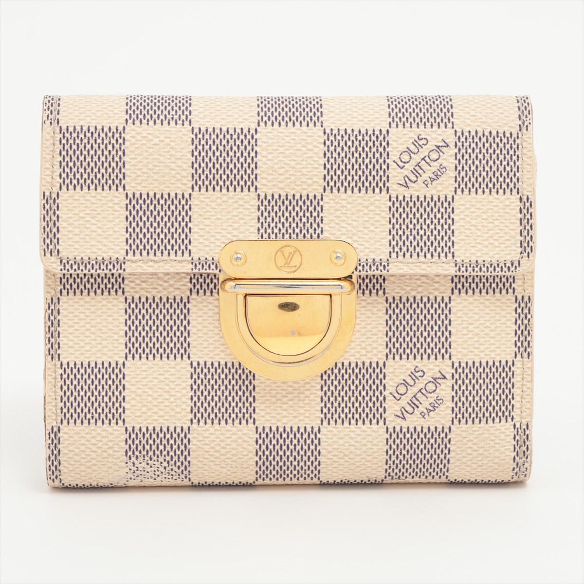 The Louis Vuitton Damier Azur Portefeuille Koala Wallet is an exquisite and versatile accessory that seamlessly combines style and practicality. Adorned with the iconic Damier Azur canvas, the wallet exudes a timeless and fresh aesthetic. The Koala