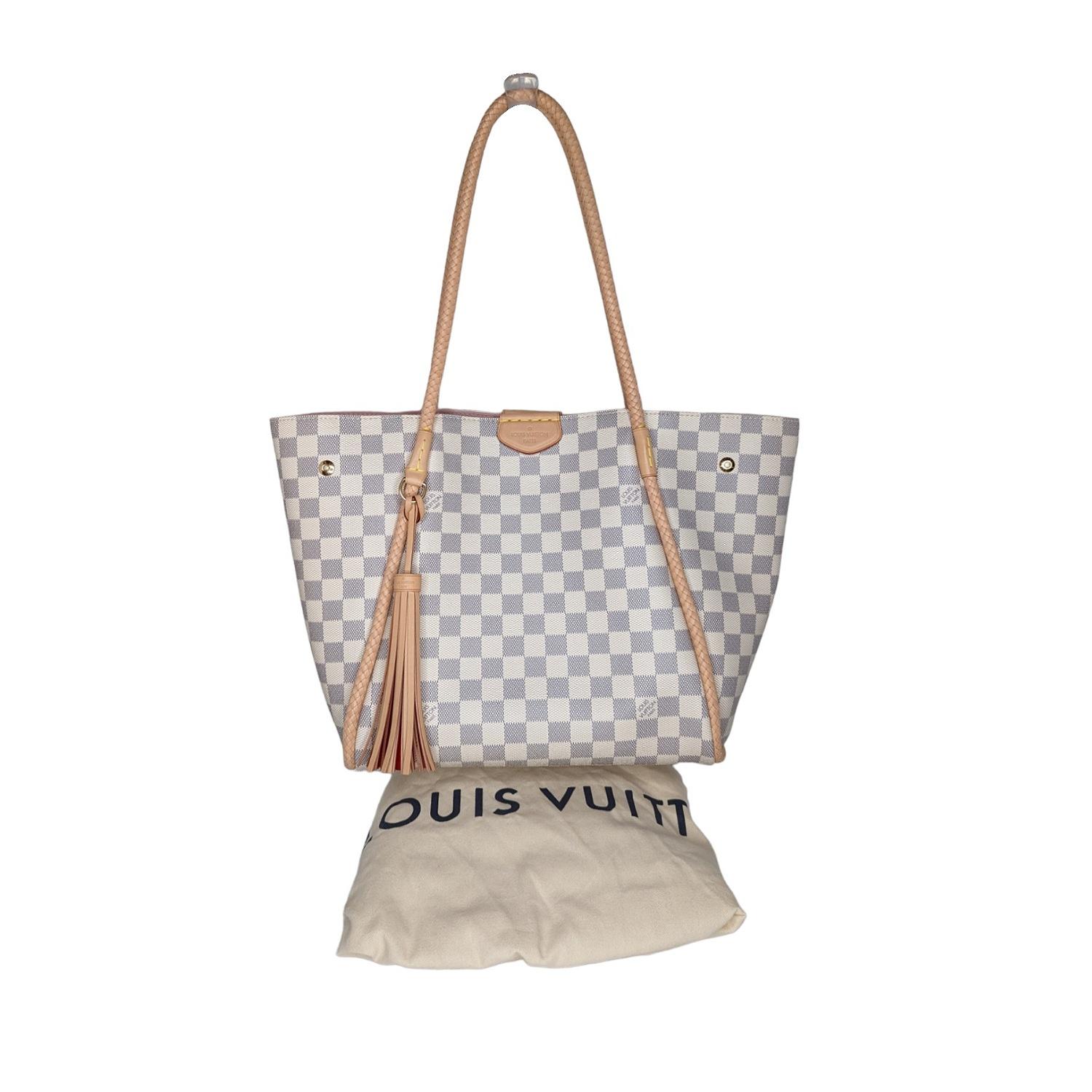 This surprisingly refined shoulder tote with its delicate braided leather piping and handles, soft rose-colored lining, and playful leather tassel is all about summer elegance. As versatile as it is chic, it’s perfect for the city and the beach.