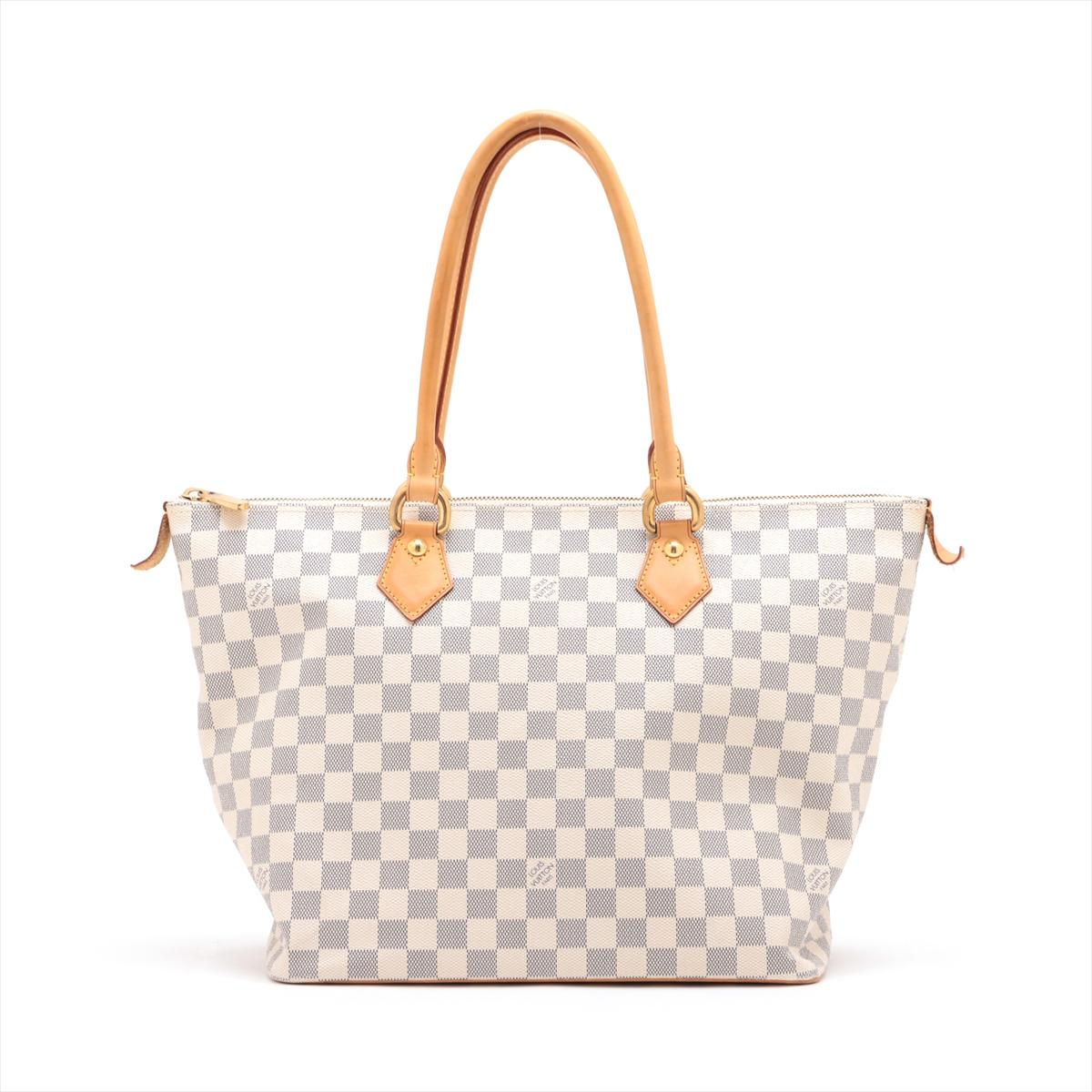 The Louis Vuitton Damier Azur Saleya MM is a sophisticated and versatile tote bag that exudes timeless elegance. Crafted from the iconic Damier Azur coated canvas, the bag showcases Louis Vuitton's signature checkered pattern in soft, refreshing