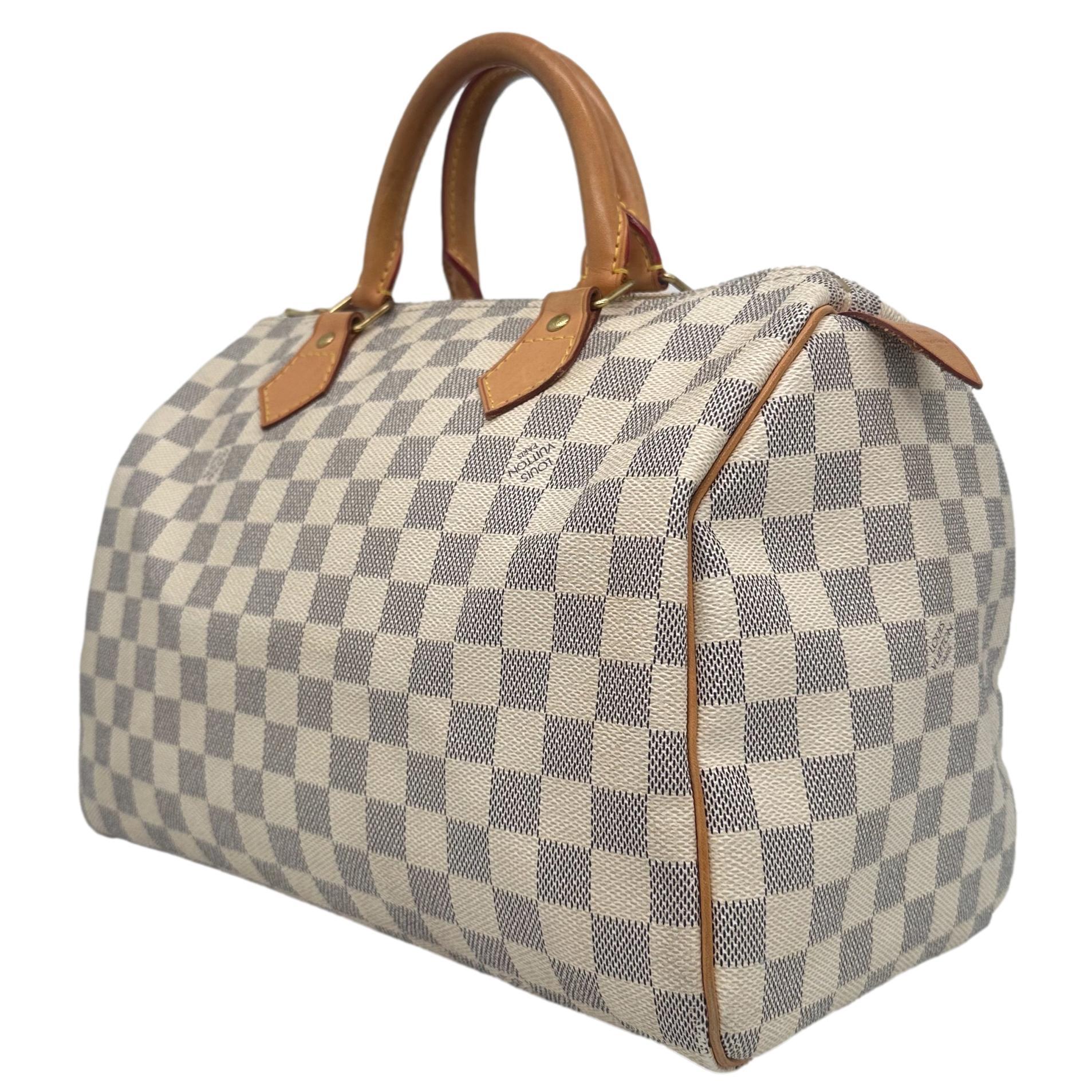 Louis Vuitton Damier Azur Speedy 30 Top Handle Bag, France 2010. This iconic speedy was first introduced in the 1930's and was designed as an alternative for the larger 