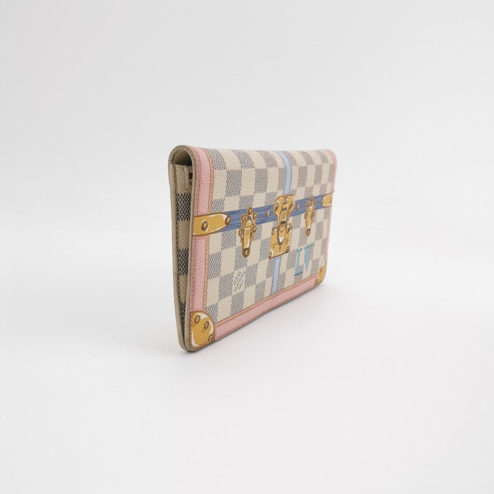 Louis Vuitton Damier Azur Summer Trunks Pochette Weekend White These are professional photos of the actual bag offered by Luxbags. Introducing the Louis Vuitton Damier Azur Summer Trunks Pochette Weekend in White - from the Spring/Summer 2018
