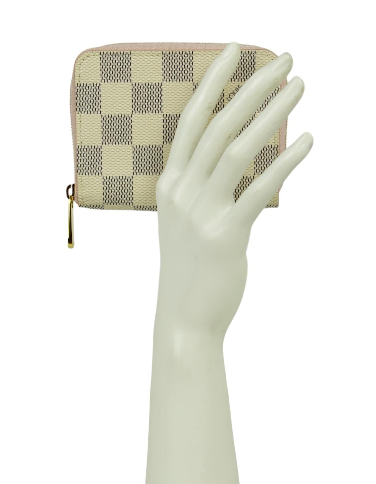 Louis Vuitton Damier Azur Zippy Coin Purse Padlock Wallet

Made In: France
Color: White, grey, pink
Hardware: Goldtone
Materials: Coated canvas
Lining: Pink grained cowhide-leather lining
Closure/Opening: Flap top with snap
Interior Pocket: 2 large
