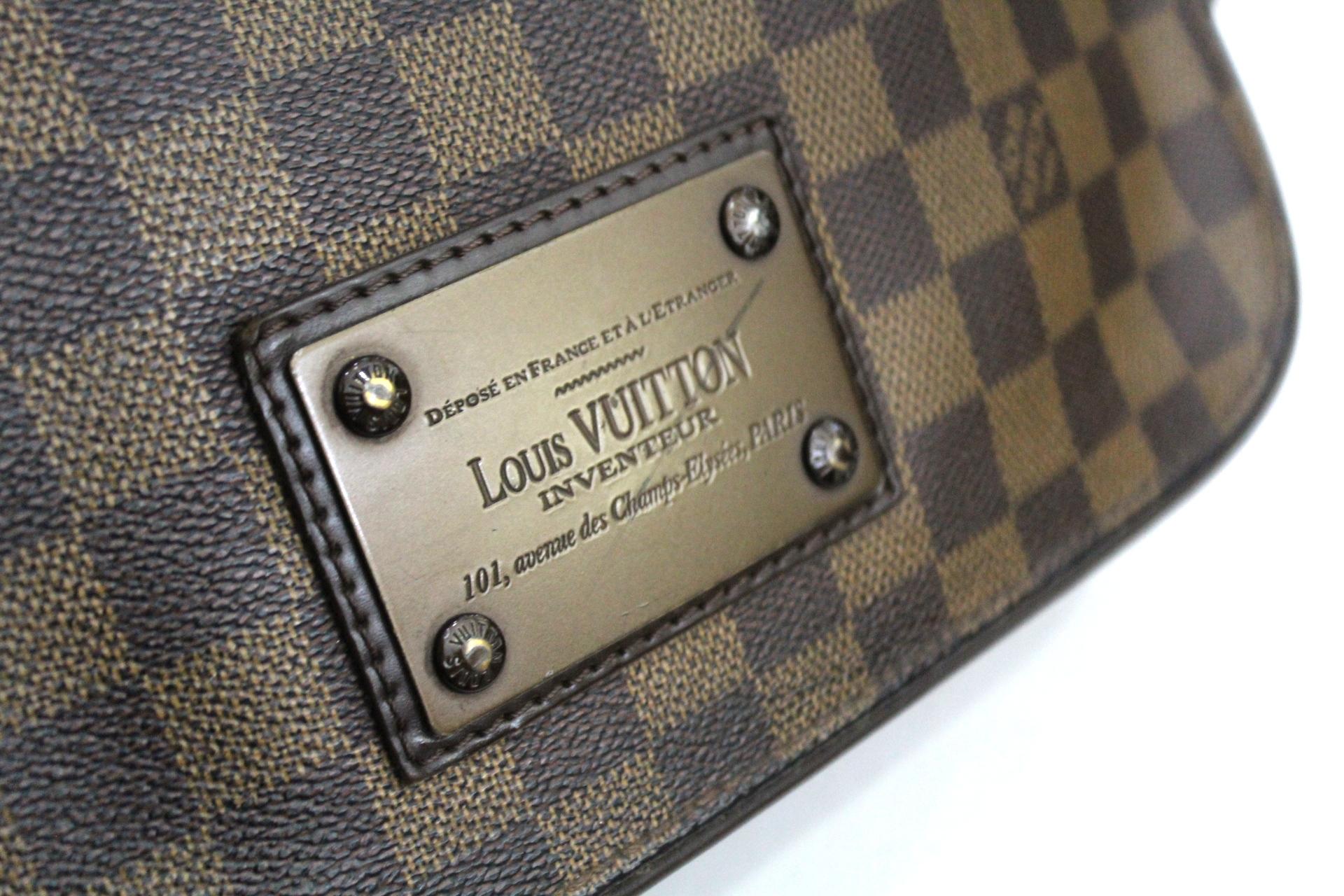 This Louis Vuitton Damier Canvas Brooklyn GM Bag is made for anyone with impeccable taste who has an affinity for utilitarian design. This bag has the classic messenger bag shape and is perfect for carrying documents and a laptop. It features a