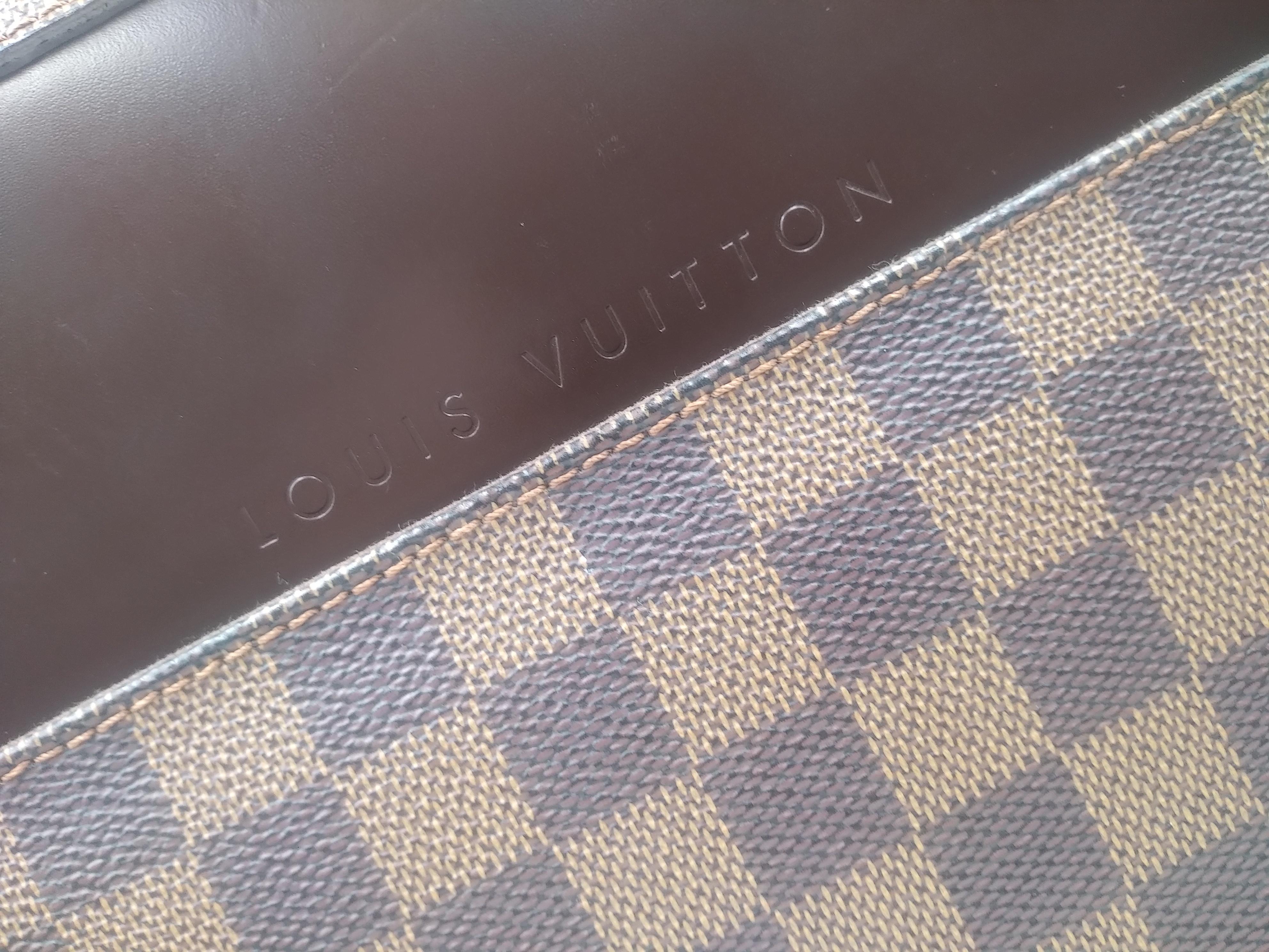 Louis Vuitton Damier Canvas Porte Ordinateur Sabana Computer Case Bag, 2006
- 100 authentic Louis Vuitton
- Damier coated canvas with chocolate brown leather trim
- Flat leather top handle and adjustable textile strap with Louis Vuitton embroidery
-