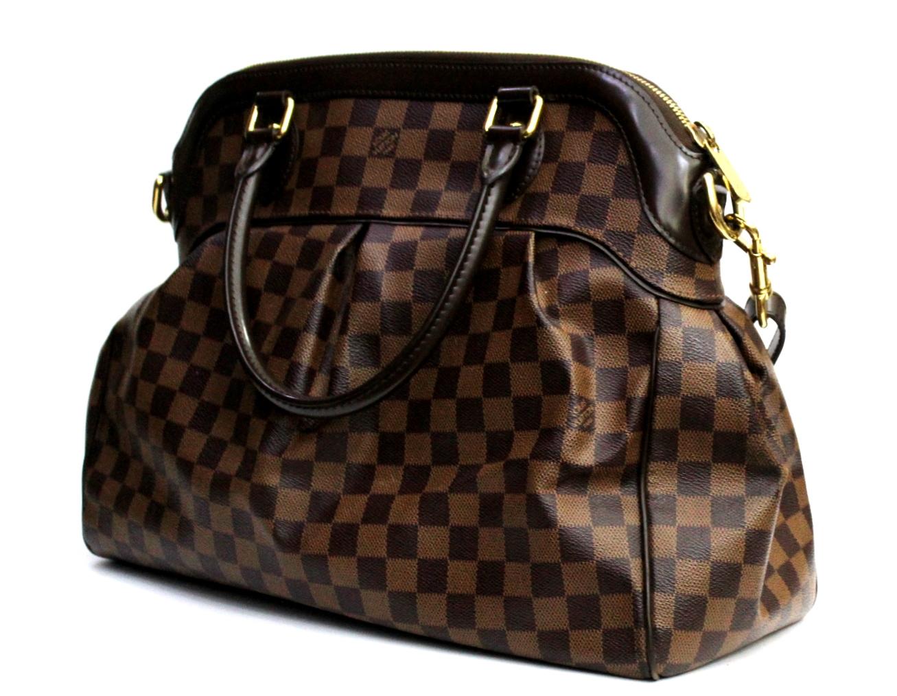 One of the most famous bag by Louis Vuitton. The Louis Vuitton Damier Trevi GM is a stunning bag that's big on style and versatility. With its roomy capacity, it is perfect for a day of shopping or a weekend trip and the included strap let's you