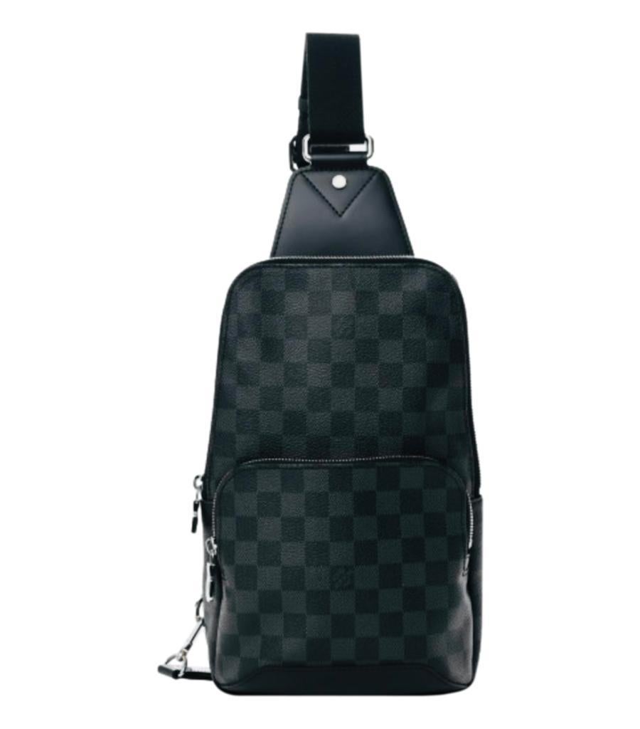 Louis Vuitton Damier Coated Canvas Avenue Sling Bag

Grey and black backpack styled with signature Damier design.

Featuring zipped pocket to the front and wrap-around zipper leading to black interior with patch pocket.

Detailed with silver, logo