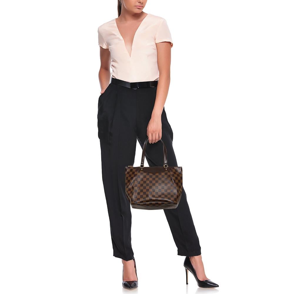 Encompassing style and luxury in equal measures, this Westminster tote from Louis Vuitton is truly worth the buy. The amazing tote is crafted from the signature Damier Ebene canvas with subtle pleats and styled with dual handles that are anchored by