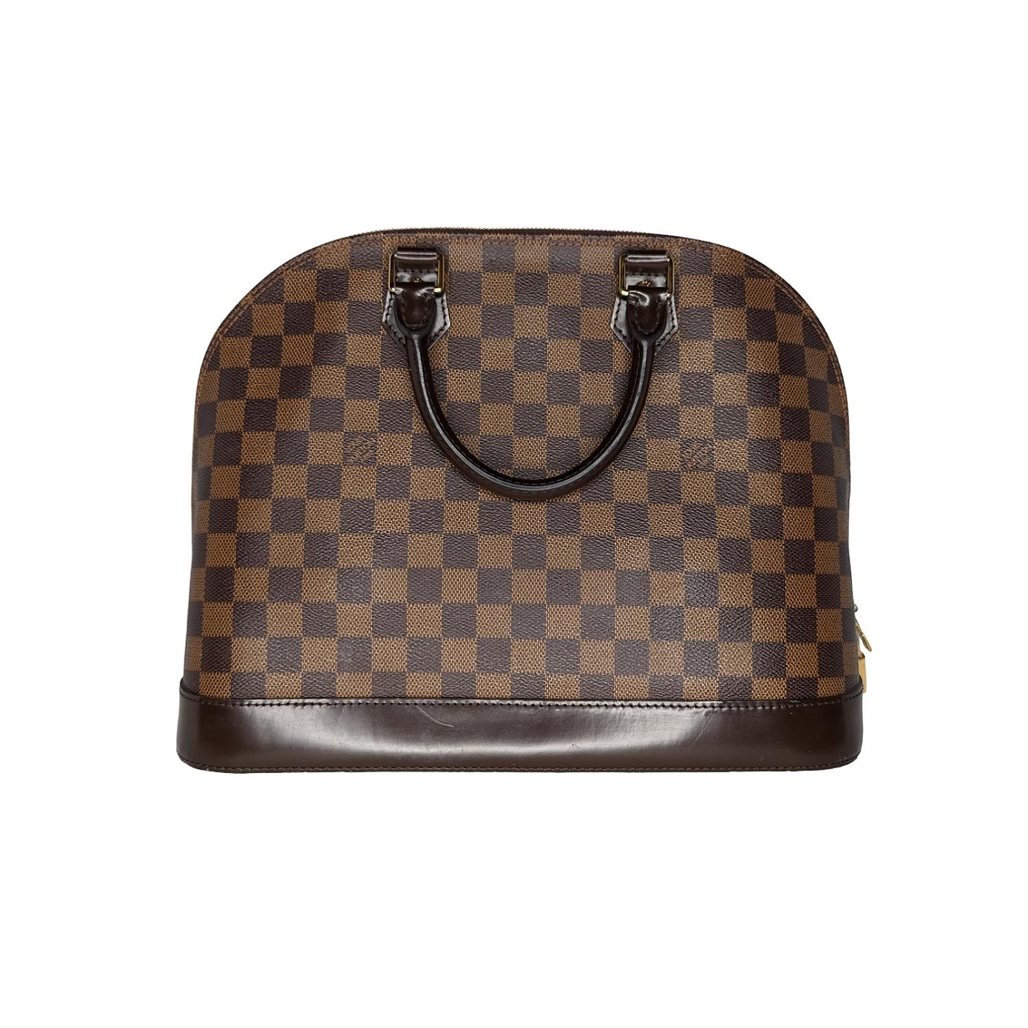 This bowling style tote is crafted of signature Louis Vuitton Damier checked coated canvas in brown. This bag features a complimentary dark brown leather solid base, rolled leather top handles and brass hardware. The top wrap around zippers opens to