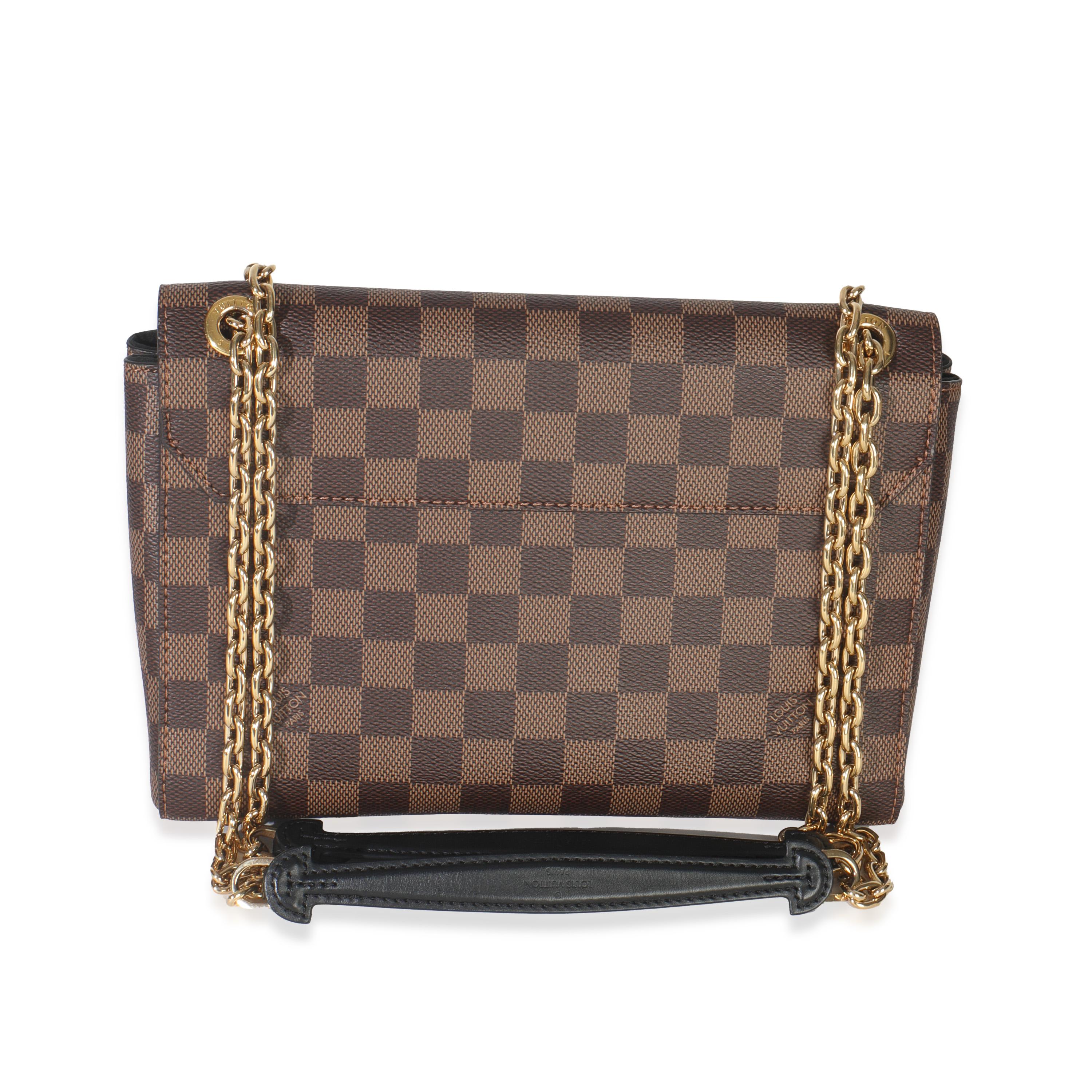 Titre de la liste : Louis Vuitton Damier Ebène et Vavin noir PM
SKU : Z150157
MSRP : 2570.00 USD
Condit : Usagé 
Description de l'état : Livré avec ses papiers.
Condition du sac à main : Excellent
Commentaires sur l'état : L'article est en excellent