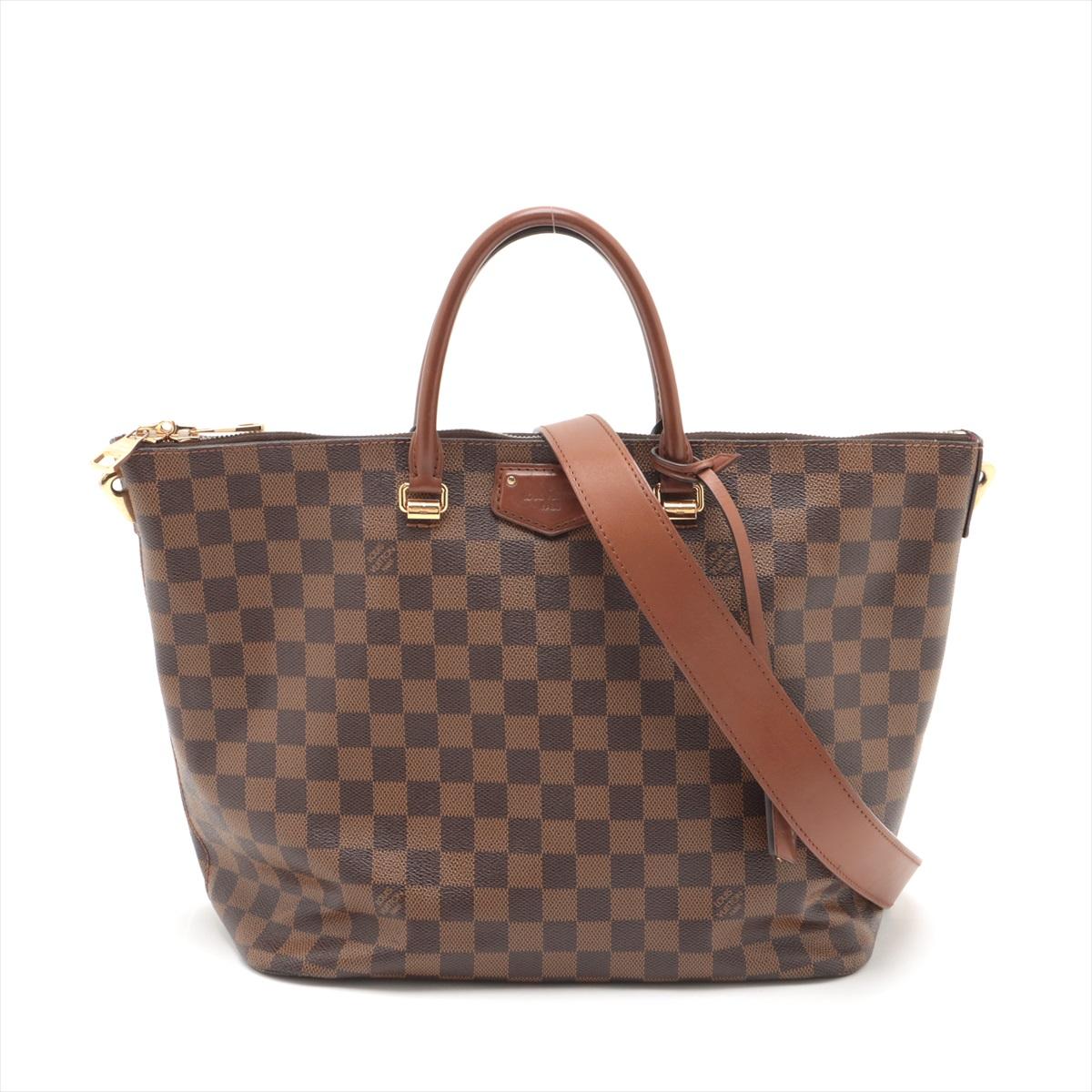 The Louis Vuitton Damier Ebene Belmont is a sophisticated and practical tote bag designed for everyday elegance. Crafted from the brand's iconic Damier Ebene canvas, the tote exudes luxury and timeless style. Its structured silhouette is accented