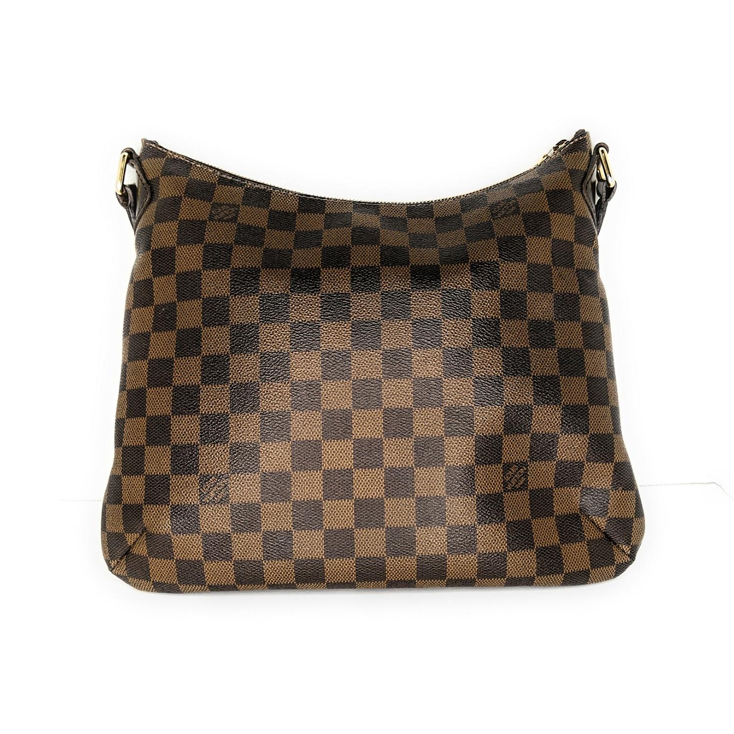 This Louis Vuitton Damier Ebene Canvas Bloomsbury PM Bag is a newer creation and will be your new favorite bag. With its chic design, pleated details and adjustable long shoulder strap, this versatile and practical bag will never go out of