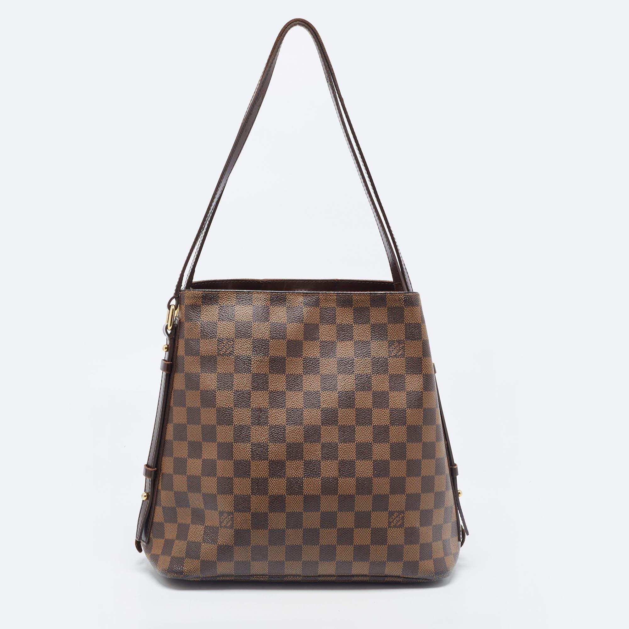The finest bags come from Louis Vuitton's workhouse, for sure. Made from Damier Ebene canvas, this bag has leather trims, two leather handles, and zippers on the sides that can be unzipped to grant more space. Complete with a canvas interior, this