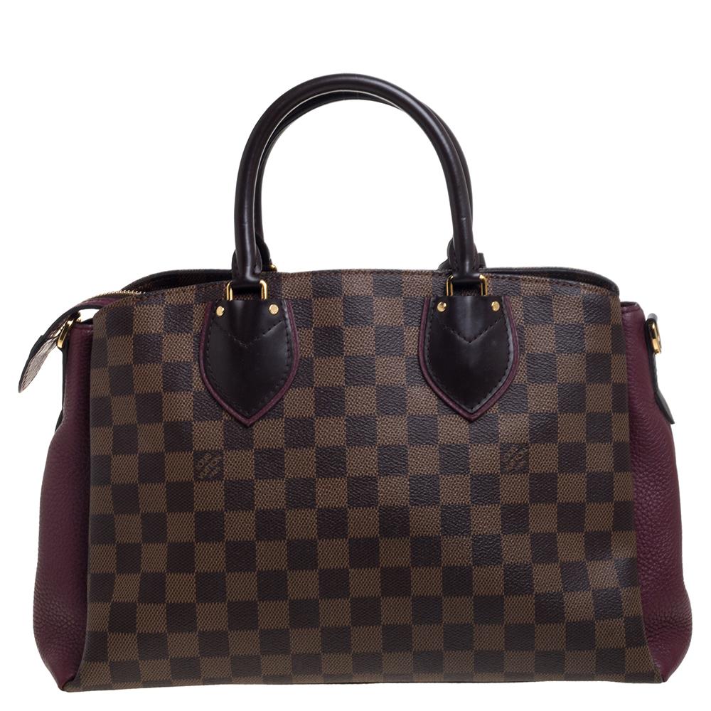 Sophisticated and high on style, Louis Vuitton's Normandy bag will be a valuable addition to your handbag collection. Crafted from Damier Ebene canvas and leather, the bag is held by dual top handles and is equipped with a spacious interior. The