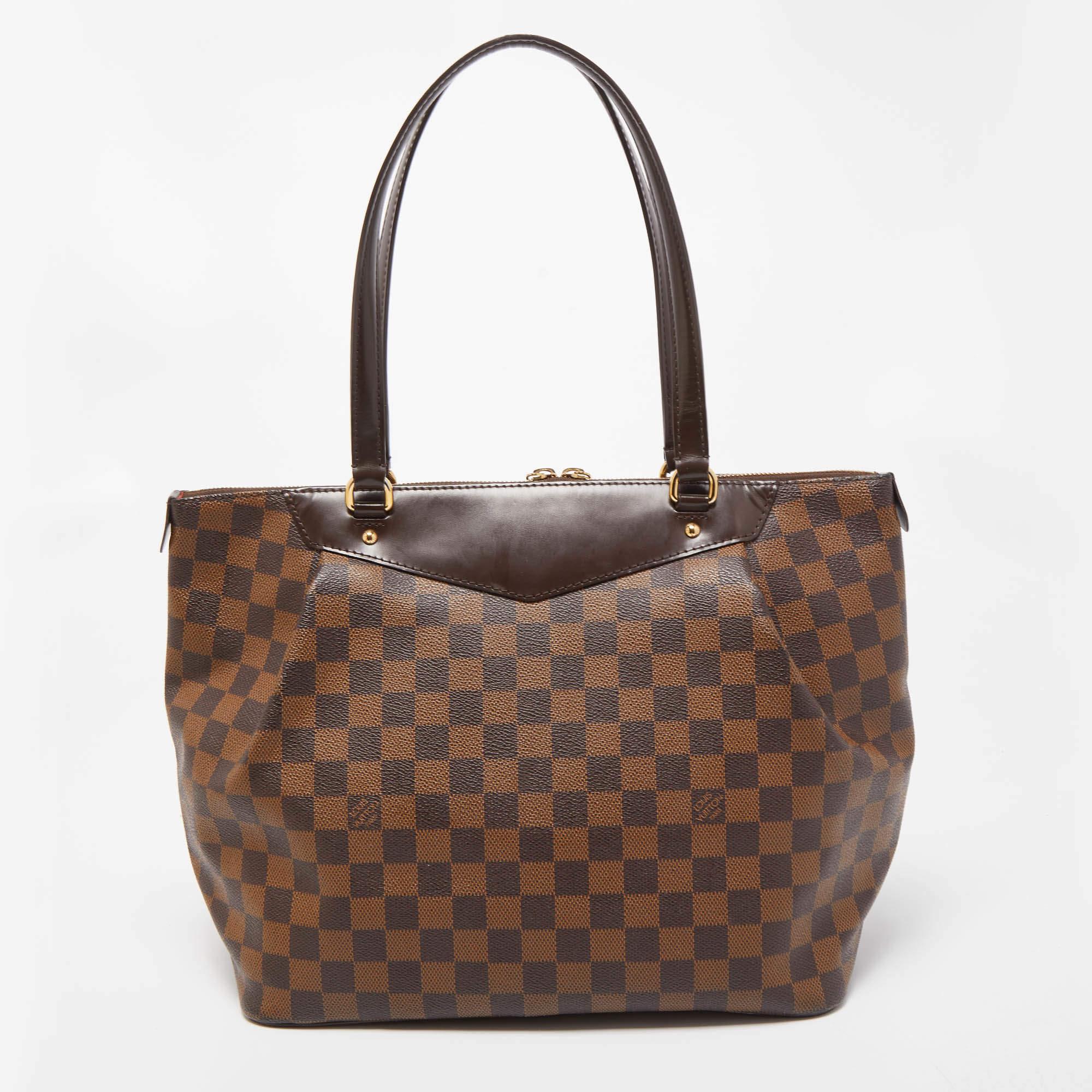 Louis Vuitton's handbags are popular for their style, durability, and functionality. This Westminister bag, like all the other designs, is long-lasting and truly fashionable. It is made from Damier Ebene canvas and leather on the exterior with