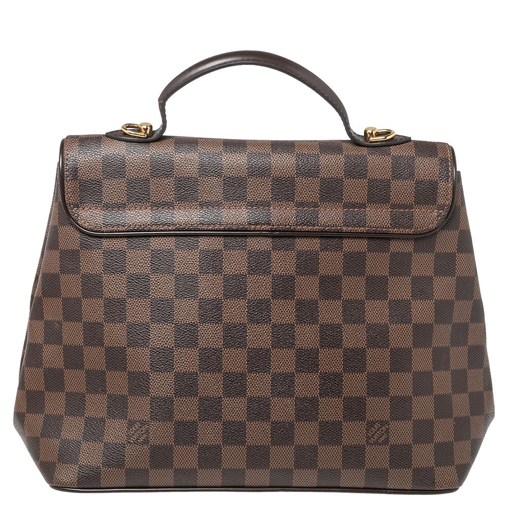 Louis Vuitton's Bergamo bag meets the expectations of what an investment-worthy bag looks like. This creation has been beautifully crafted from signature Damier Ebene canvas and styled with a front flap that has a twist lock. The insides are lined