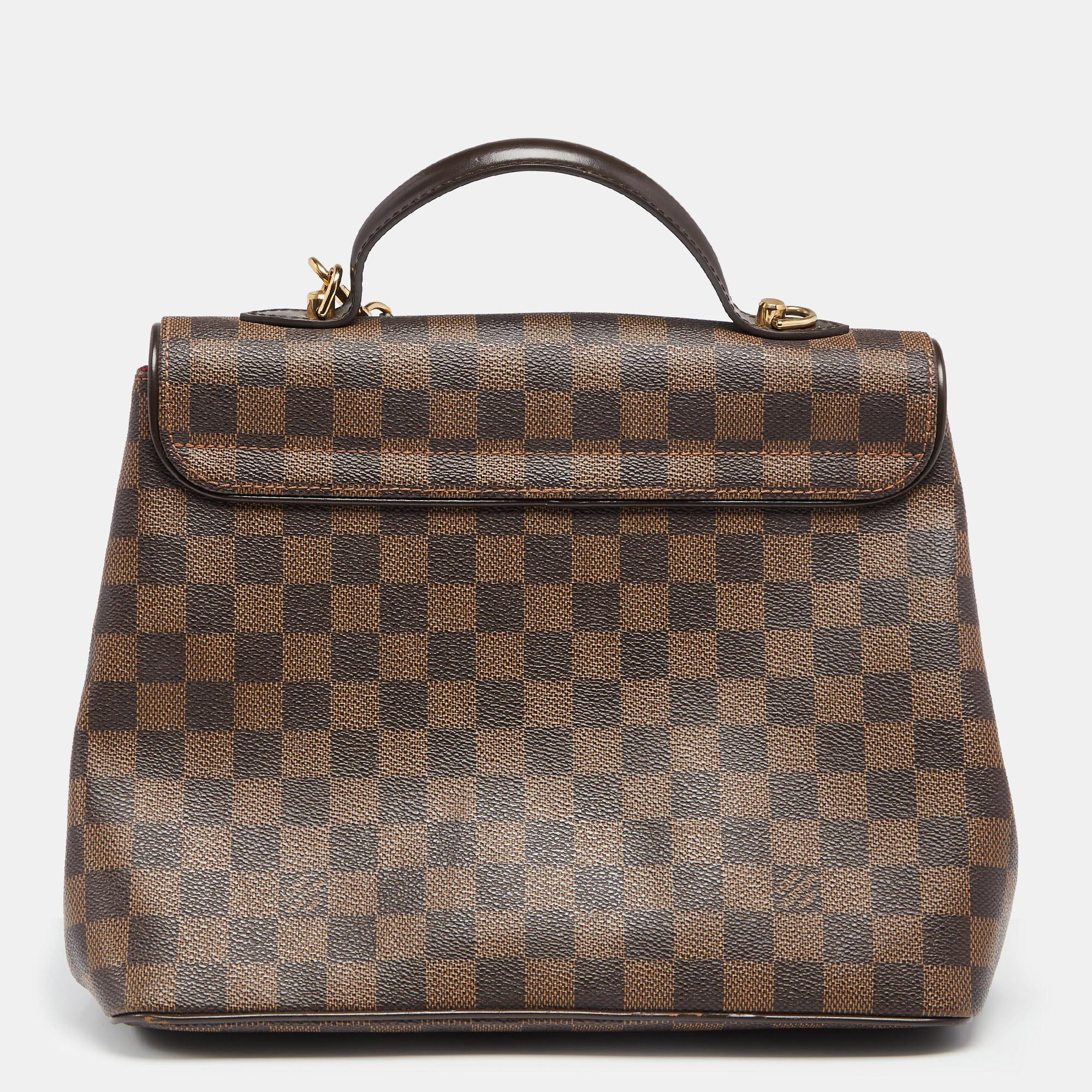 Louis Vuitton is trusted to mark a striking statement in the world of fashion with its phenomenal pieces. This Bergamo bag surely meets your expectations. This creation has been beautifully crafted from Damier Ebene and styled with a flap that has a