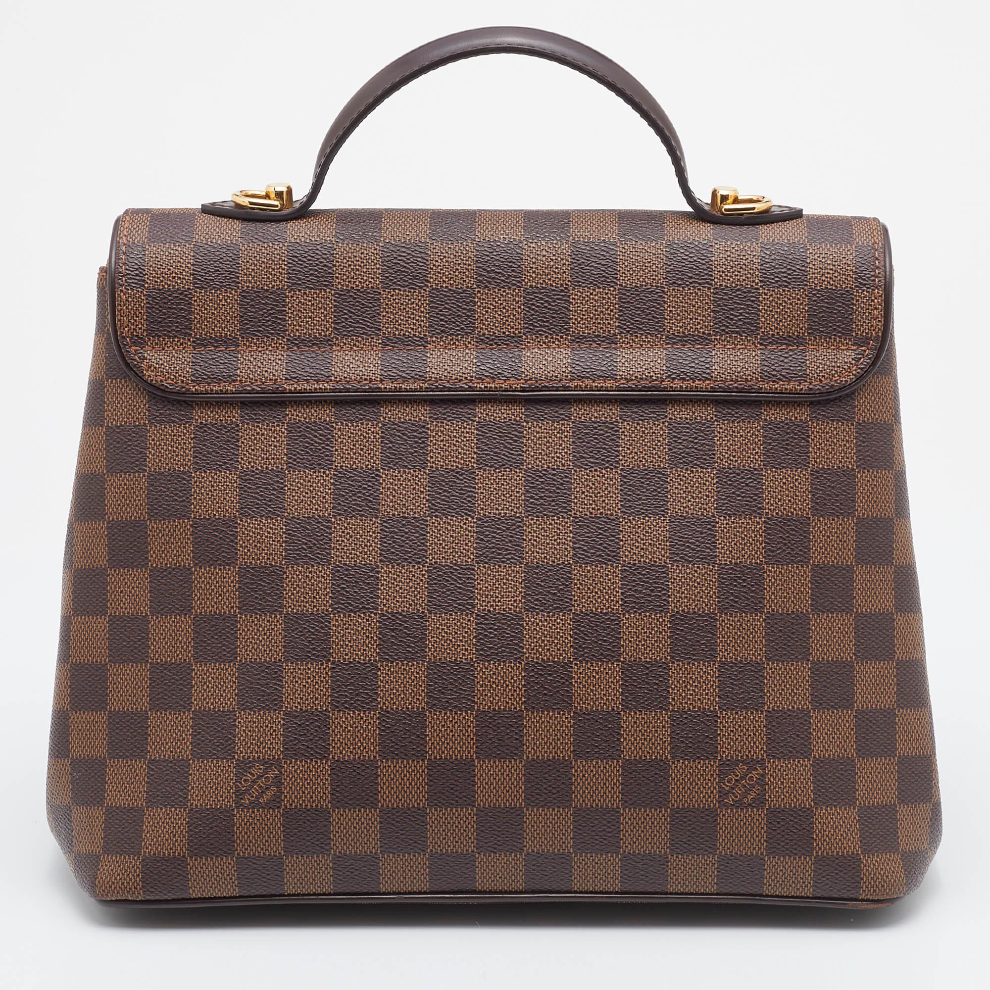 Louis Vuitton's Bergamo bag meets the expectations of an investment-worthy bag. This creation has been beautifully crafted from signature Damier Ebene canvas & leather and styled with a front flap that has a twist lock. The insides are lined with