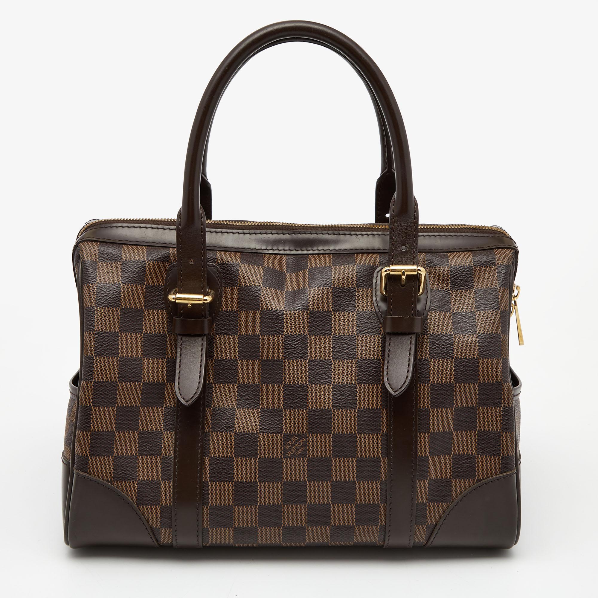 Combining Louis Vuitton’s rich heritage with exquisite craftsmanship, this Berkeley bag is one you shouldn't miss. Made from signature Damier Ebene canvas, this fabulous style is finished with leather trims and two handles. The brand plaque on the