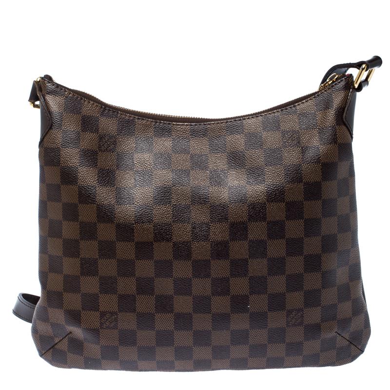 Crafted from Damier Ebene canvas, this Bloomsbury bag from Louis Vuitton is sure to elevate your style. It features a subtle pleat on the front with a Louis Vuitton plaque, front pocket and a fabric-lined interior secured by a zipper. It is complete