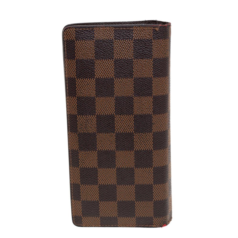 The Brazza wallet by Louis Vuitton will instantly become your favorite. It comes with multiple card slots, a zip pocket, and slip pockets. Made from the signature Damier Ebene canvas, the wallet is designed in a sleek shape to easily fit into your