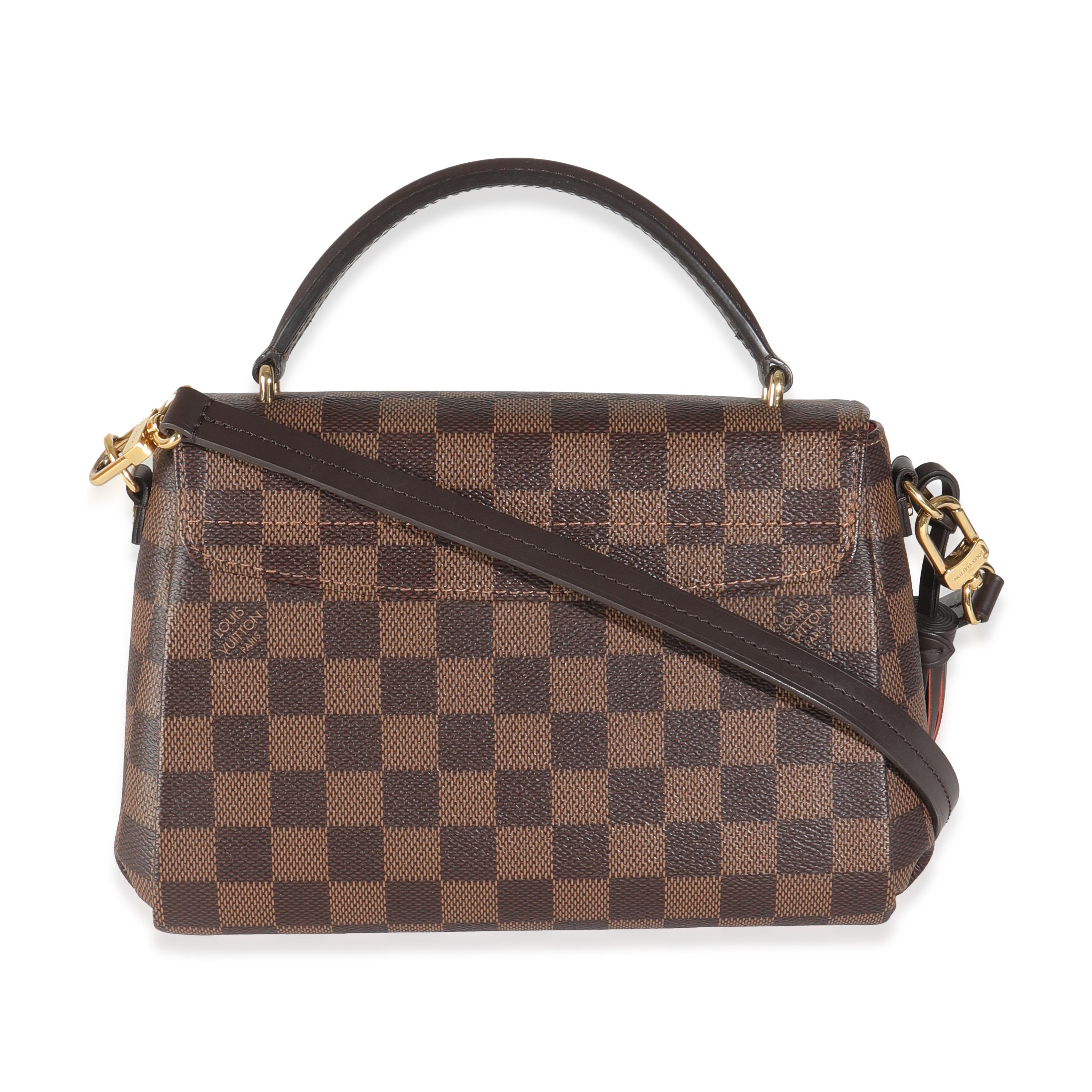 Listing Title: Louis Vuitton Damier Ebene Canvas Croisette
SKU: 144720
Condition: Pre-owned 
Handbag Condition: Excellent
Condition Comments: Item is in excellent condition and displays light signs of wear.   Light scratching along hardware.
Brand: