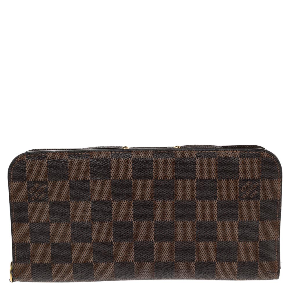 The Insolite wallet by Louis Vuitton is packed with utility and luxurious appeal. Crafted in Spain, this LV wallet has a Damier Ebene canvas exterior and snap buttons that reveal multiple slots and zipped compartments.

