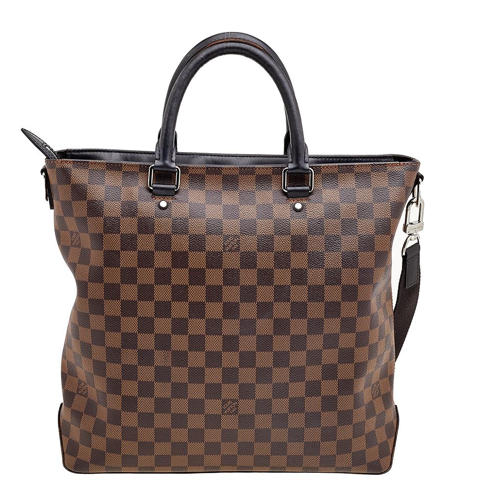Keep your documents and other essentials safe and organized when you carry this Jake bag by Louis Vuitton. Crafted with Louis Vuitton’s Damier Ebene coated canvas, it features dual top handles and an adjustable shoulder strap to keep your hands