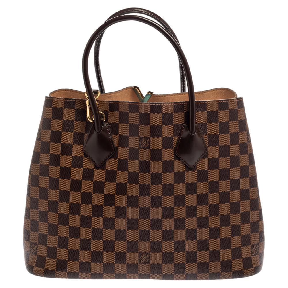 Spacious and captivating, this Kensington V bag is from Louis Vuitton. It has been crafted from Damier Ebene canvas and accented with gold-tone hardware. It is equipped with two handles, and an open-top that reveals a well-sized Alcantara interior.