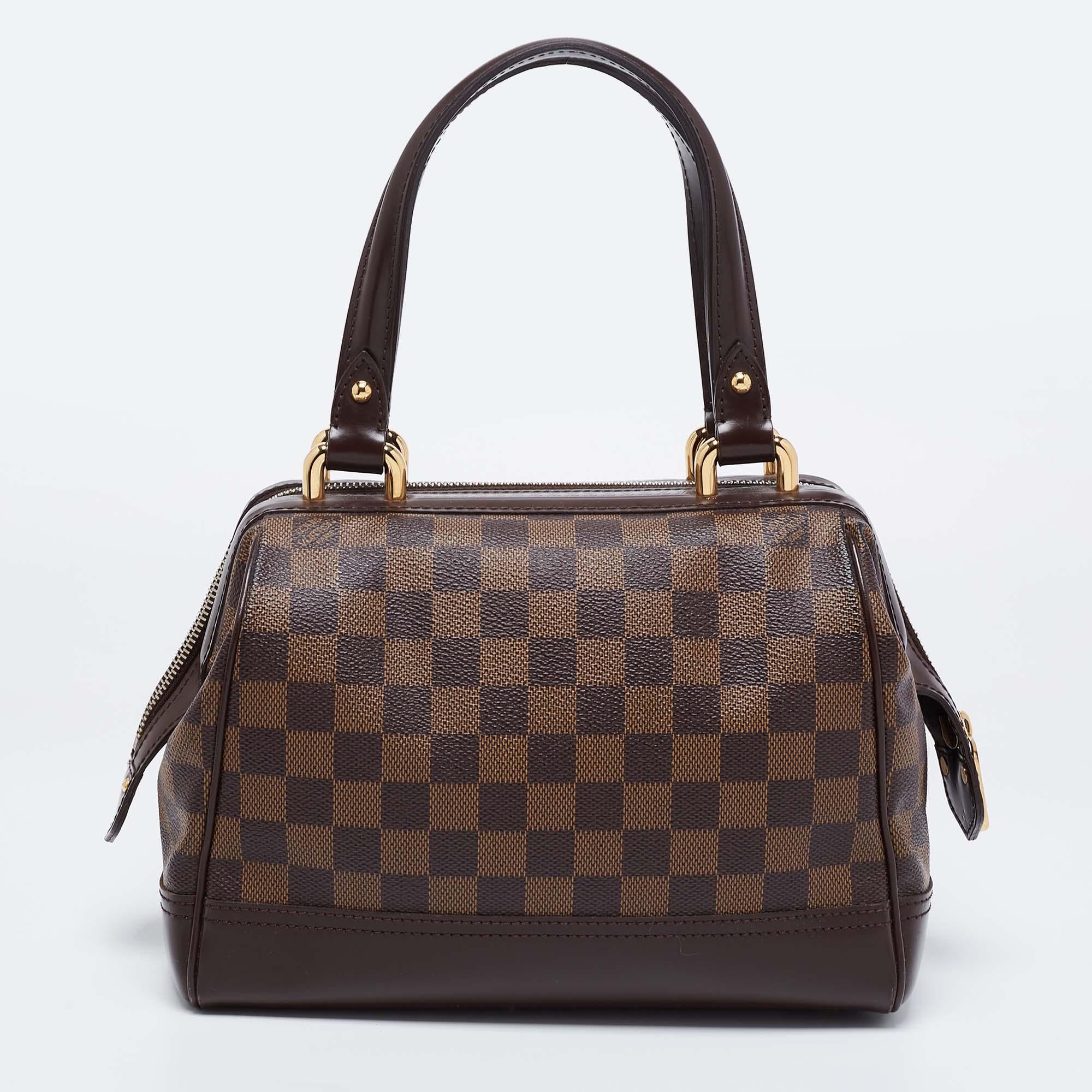 Louis Vuitton's handbags are popular owing to their high style and functionality. This Knightsbridge Bag, like all the other handbags, is durable and stylish. Crafted from their Damier Ebene canvas, the bag comes with two flat handles and a top