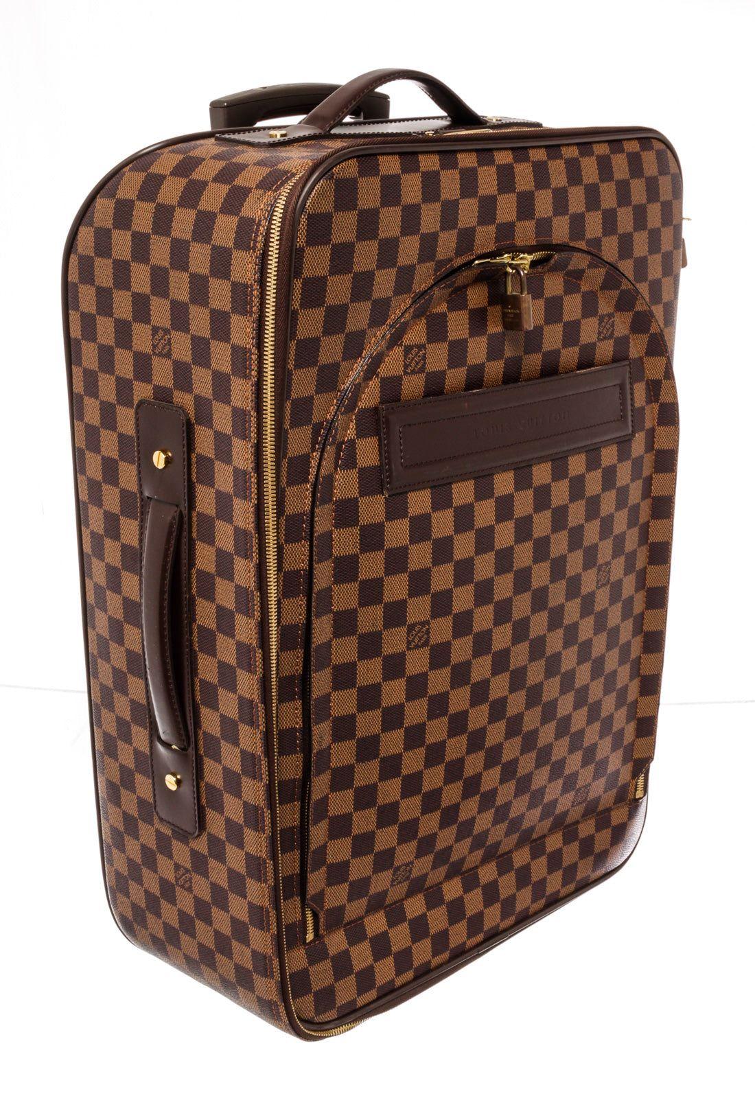 Brown Damier Ebene coated canvas Louis Vuitton Pegase 55 with Macassar leather trimmings, gold-tone hardware, retractable pull handle, zip pocket at front, dual wheels at base, two internal zip pockets with Velcro security strap, and two-way zip