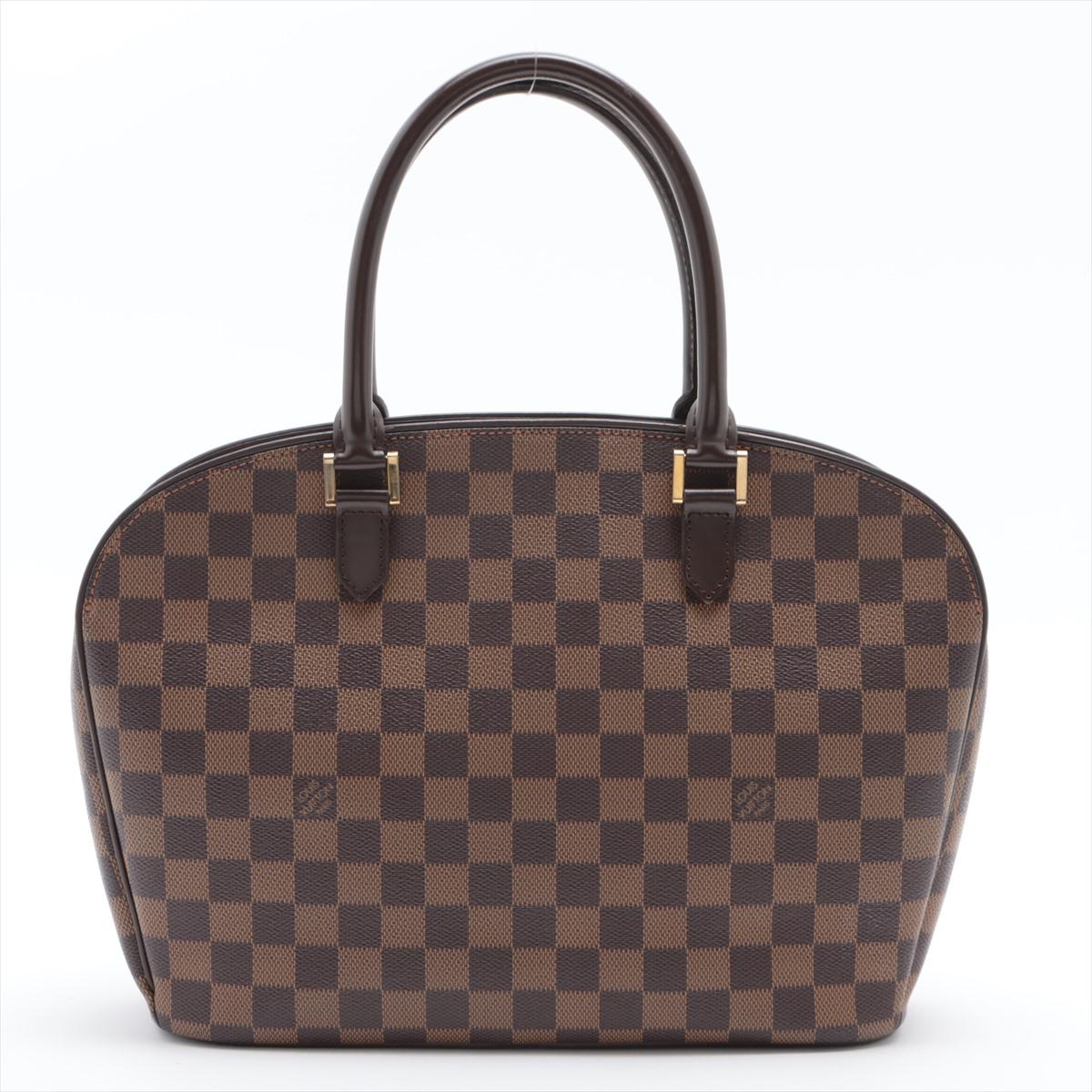 Brown Damier Ebene coated canvas Louis Vuitton Sarria Horizontal bag with dark brown leather trim, gold-tone hardware, rust red Alcantara microfiber lining, two interior slip pockets, slip pocket on front exterior, dual rolled top handles, and zip