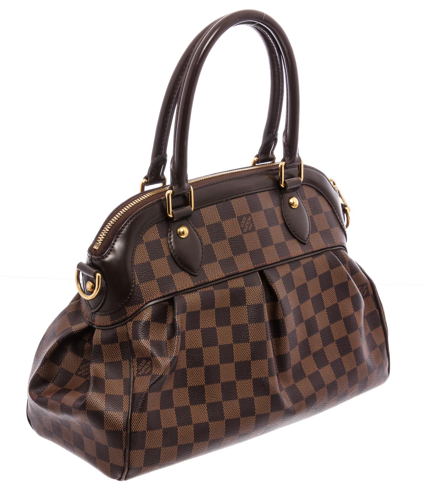 Brown and tobacco Damier Ebene coated canvas Louis Vuitton Trevi PM with brass hardware, mocha leather trim, optional shoulder strap, dual rolled handles, red Alcantara lining, dual slit pockets at interior walls and zip closure and zip closure at