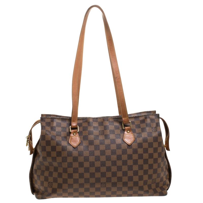 Made from signature Damier Ebene canvas and leather, this Chelsea bag is from the 1896-1996 Edition Centenaire and it is limited. The Louis Vuitton tote features dual top handles and a flat base. The canvas-lined interior is spacious and can carry