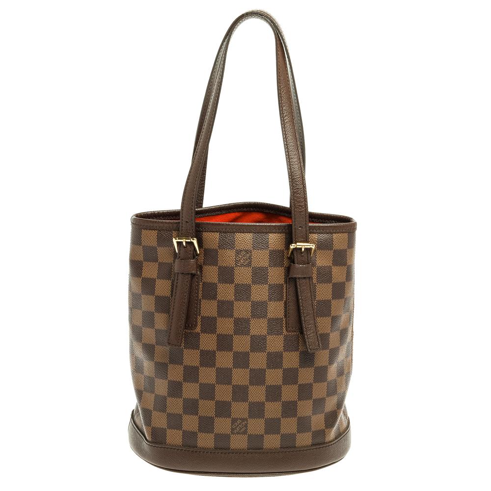 Named after the historic Le Marais district in Paris, the Marais bag is a modern design from the house of Louis Vuitton. Exuding the label's rich craftsmanship and creativity, the bag is rendered in Damier Ebene canvas and features a beautiful,