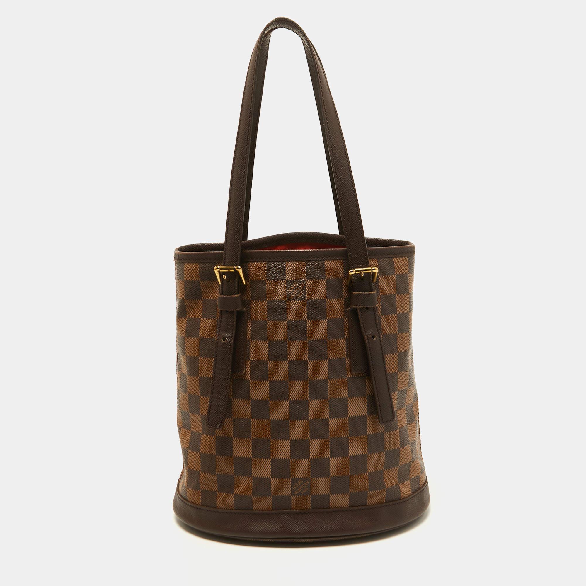 Named after the historic Le Marais district in Paris, the Marais bag is a classic design from the house of Louis Vuitton. Exuding the label's rich craftsmanship and creativity, the bag is rendered in Damier Ebene canvas and features a beautiful