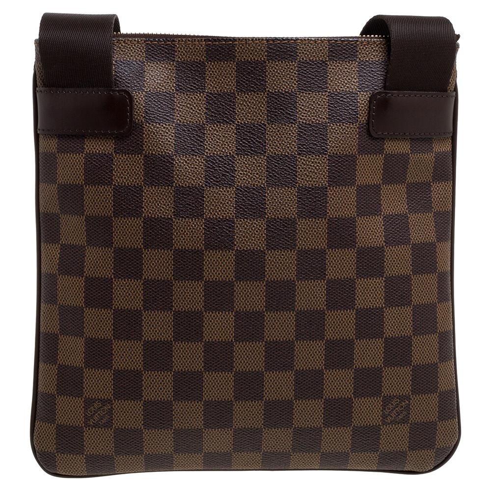 This bag is made of Damier Ebene canvas and sized to suit all your needs. It has a simple design with a front flap pocket, a well-sized fabric interior and a shoulder strap. Designed to last, this piece from Louis Vuitton will be handy and reliable