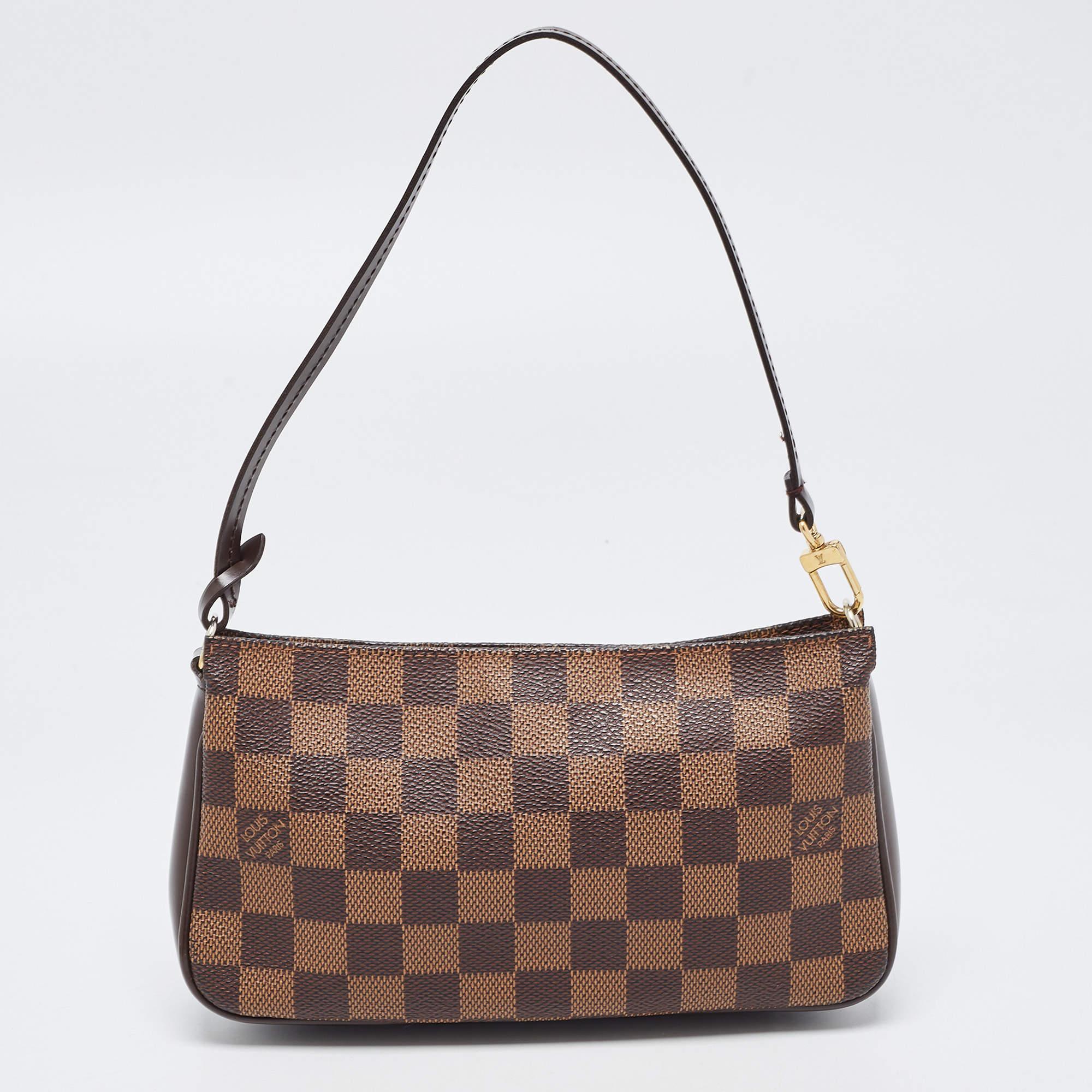 The simple silhouette and the use of durable materials for the exterior bring out the appeal of this LV pochette for women. It has a single handle and a zip-enclosed interior.

Includes: Original Dustbag


