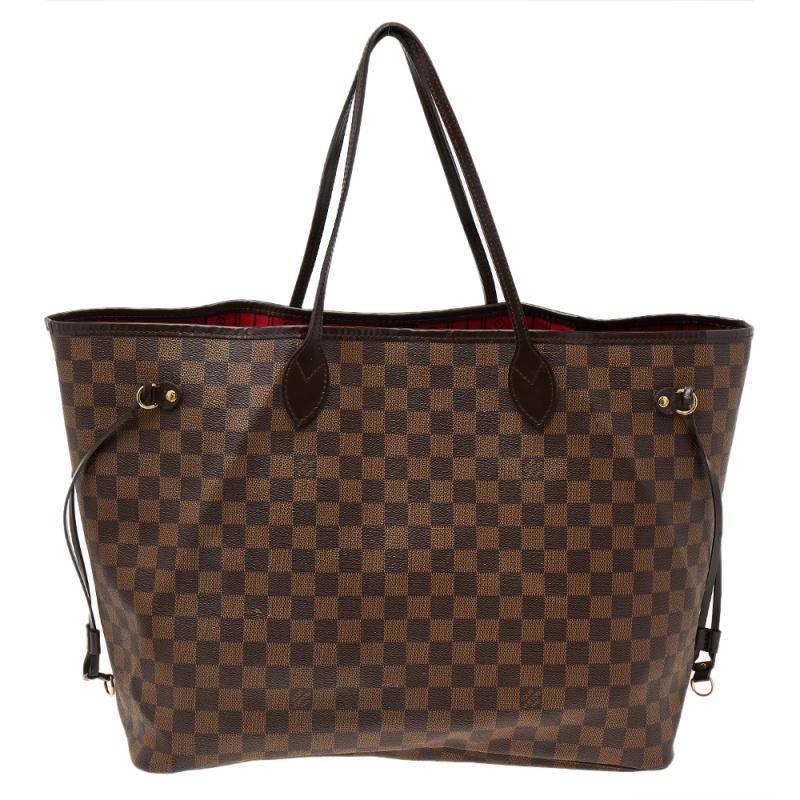 Get the ultimate fashionable casual look with this gorgeous Louis Vuitton Neverfull GM. The bag features LV's signature Damier Ebene coated canvas exterior with leather trim and top handles. It is accented with side leather strings with gold-tone
