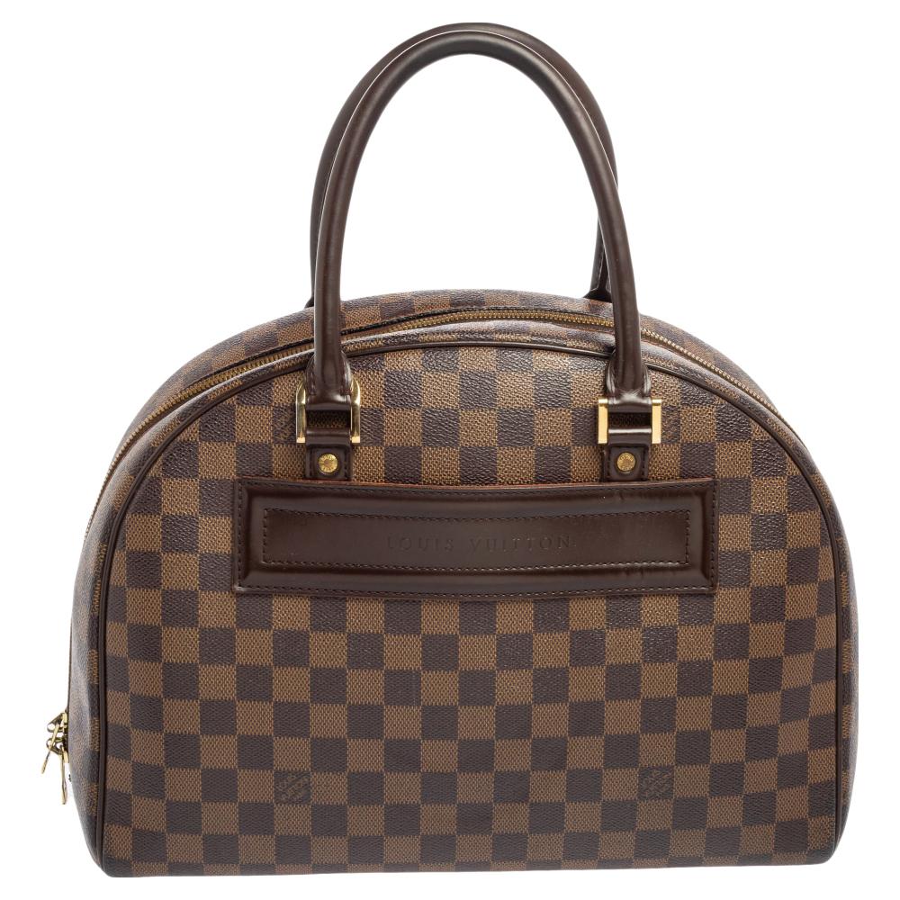 This Louis Vuitton Nolita bag brings you the best of craftsmanship and classic appeal. Crafted using Damier Ebene canvas, this timeless gem, featuring dual handles, a spacious interior, and gold-tone hardware, will be an excellent addition to your