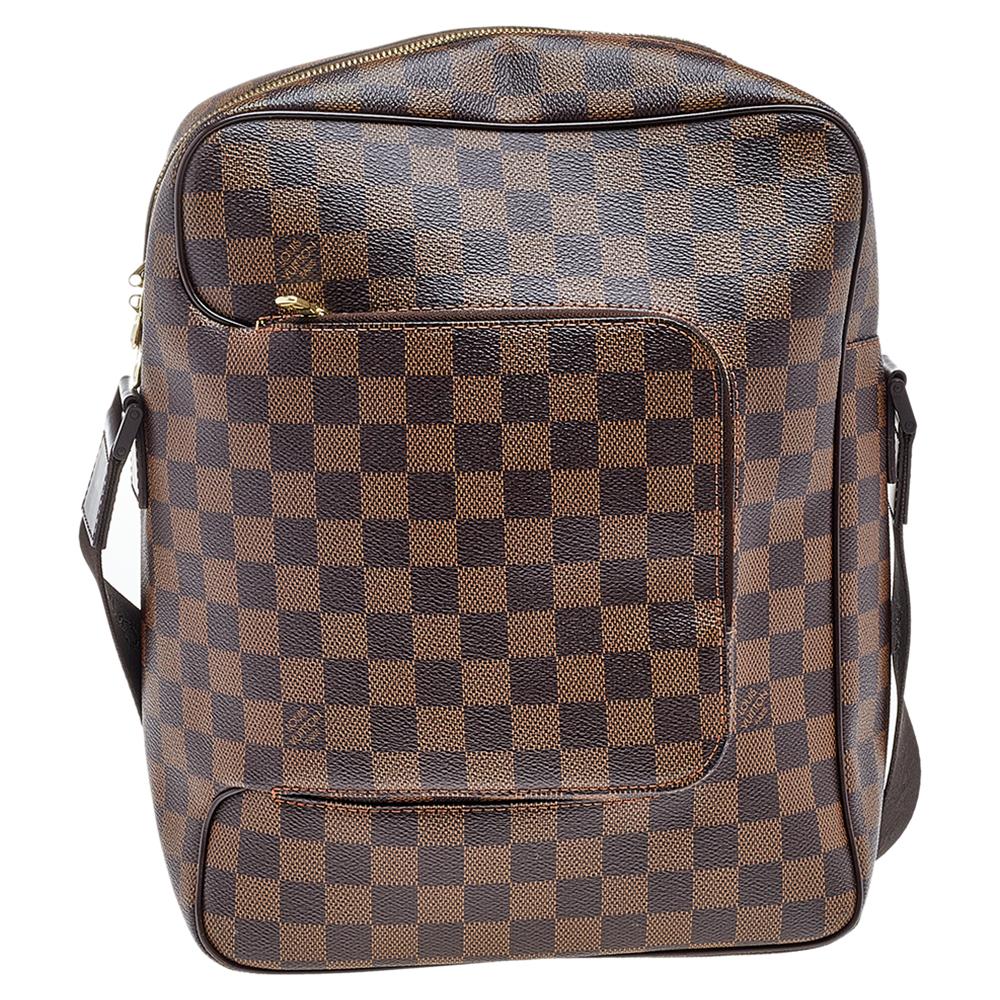 This sophisticated Louis Vuitton Olav MM bag is the ideal hands-free bag to add to your closet. It is crafted from signature Damier Ebene canvas and features a single adjustable shoulder strap. Accented with gold-tone hardware, this messenger bag