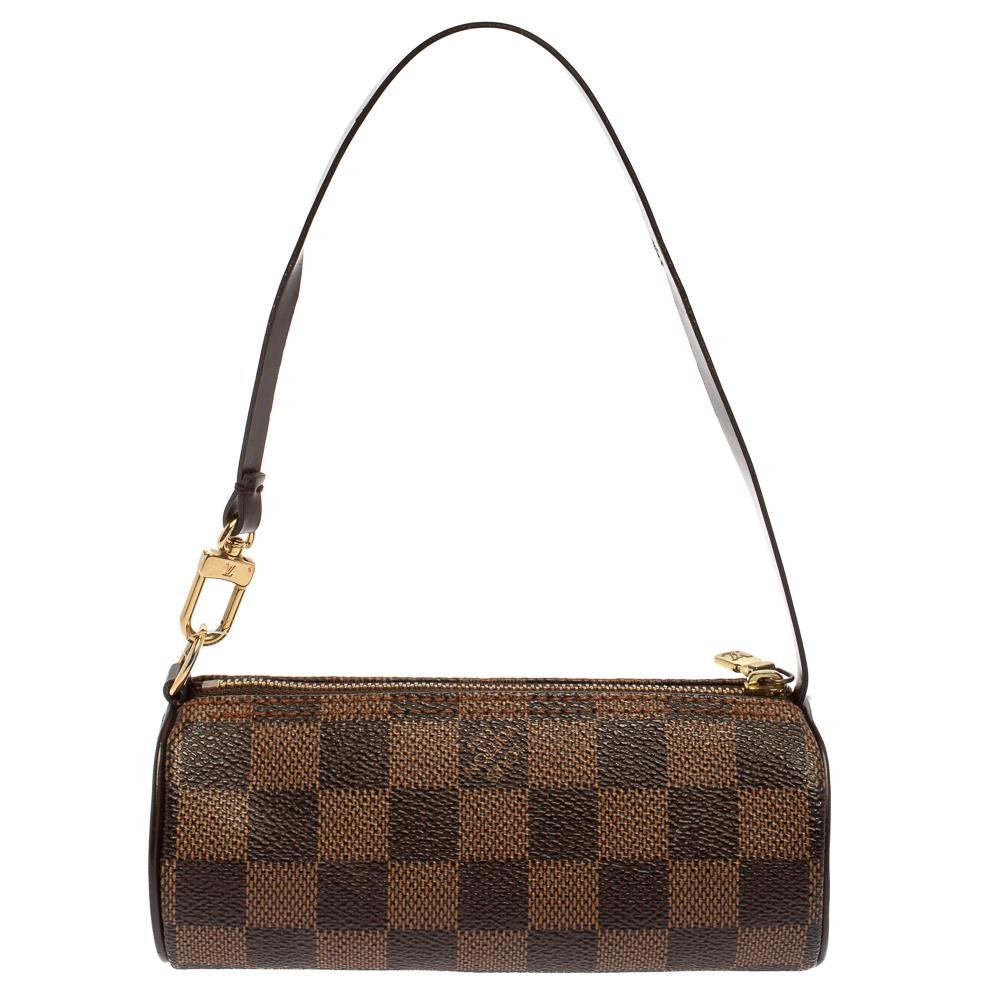 Another classic from the house of Louis Vuitton is this beautiful Papillon. The pouch is made from Damier Ebene coated canvas, lending it durability. The top zip closure opens to a leather interior that will safely keep your belongings and a single