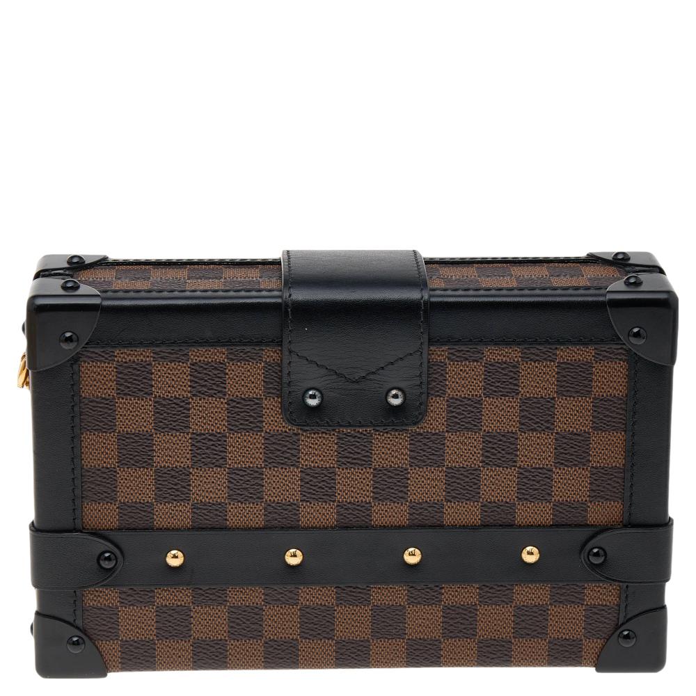 If you're looking for a bag with a blend of modern style and exquisite craftsmanship, this Louis Vuitton Petite Malle Bag is the answer. Crafted from monogram coated canvas and leather, it features armored corners, a band flap with a logo-engraved