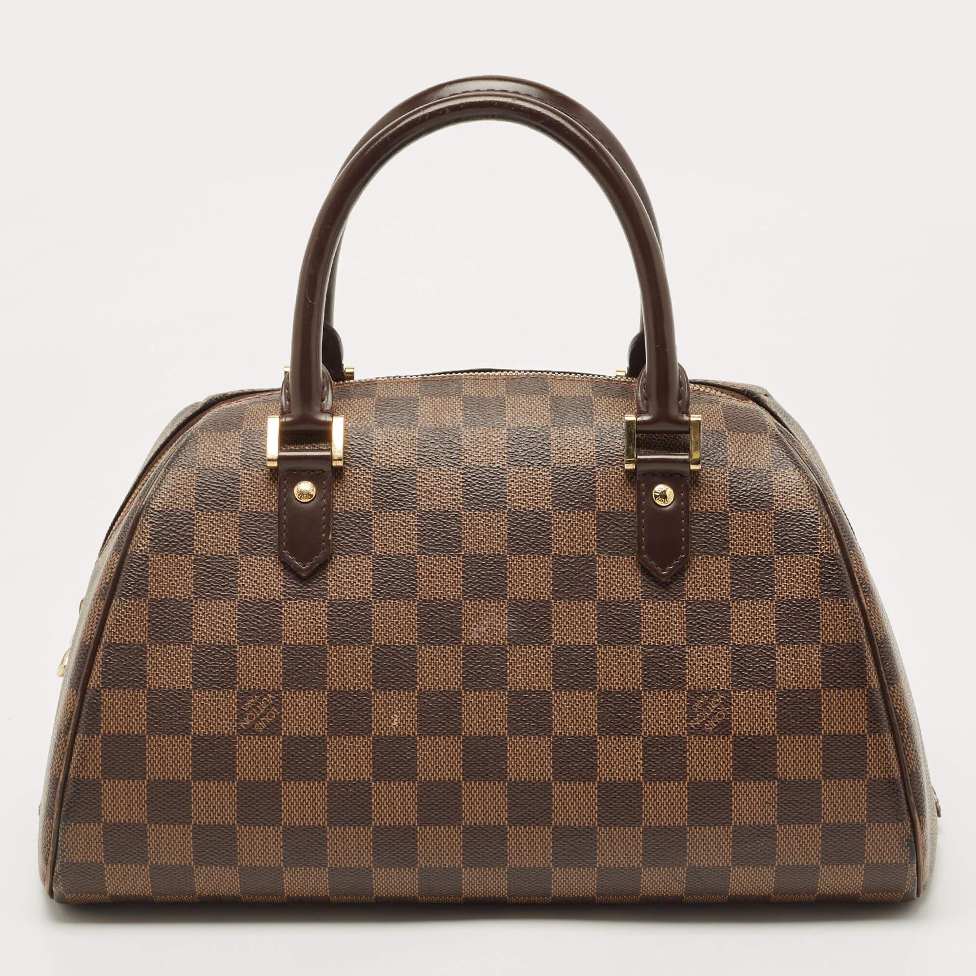Louis Vuitton’s Ribera MM bag will become your favourite bag in no time. Crafted from signature Damier ebene canvas, it features dual rolled top handles and a wrap-around zip closure that opens to a fabric-lined interior that houses a cell-phone