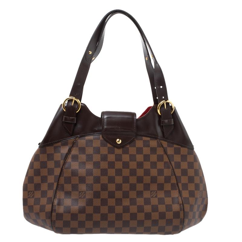 Louis Vuitton's handbags are famous for its high style, durability, and functionality. This Sistina bag, like all the other designs, is lasting and stylish. Crafted from Damier Ebene canvas, the bag can be paraded using the leather handles. It is