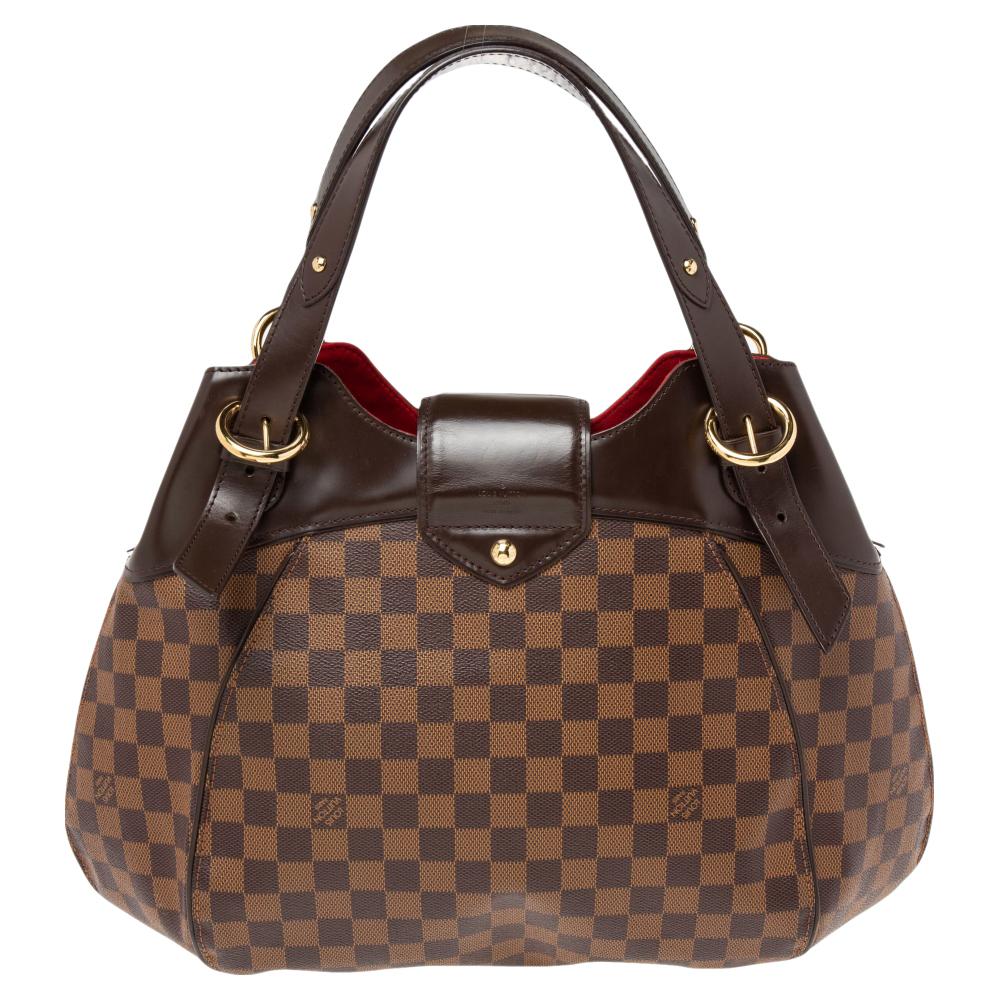 Louis Vuitton's handbags are popular thanks to their high style, durability, and functionality. This Sistina bag, like all the other designs, is lasting and stylish. Crafted from Damier Ebene canvas & leather, the bag can be paraded using the top