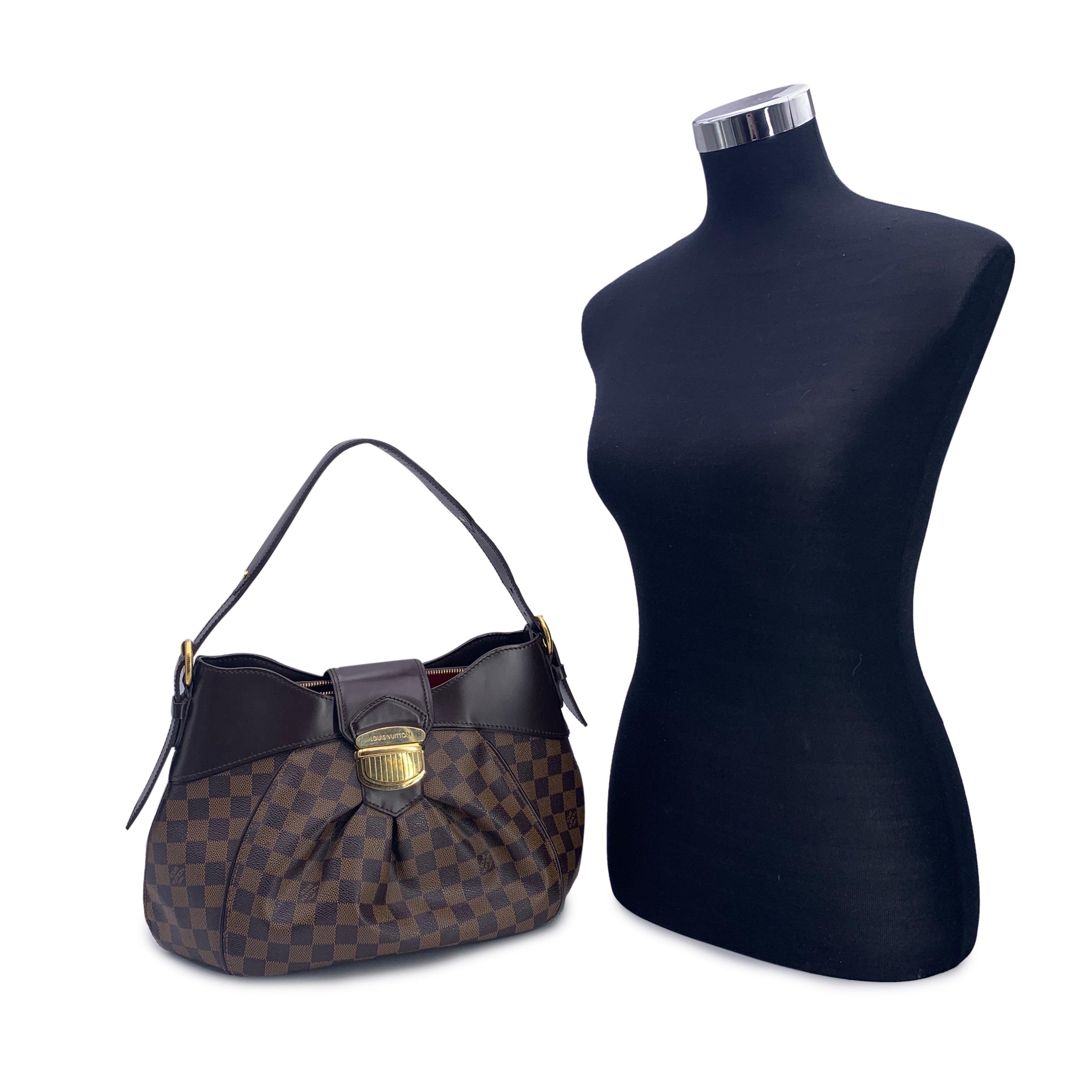 Esta hermosa Bolsa vendrá con un Certificado de Autenticidad proporcionado por Entrupy. El certificado se entregará sin coste alguno. Bolso de hombro LOUIS VUITTON 'Sistina MM'. Diseñada con la lona damier ebene y acentuada con piel marrón y